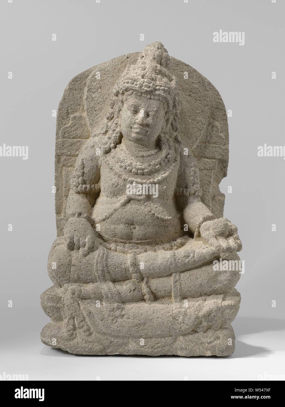 Image of the god of wealth Kubera, Image of the god of wealth Kubera., Gedong Songo, 775 - 825, andesite, extrusive rock, h 39.5 cm × w 25.2 cm × d 15.6 cm × w 15.9 kg Stock Photo