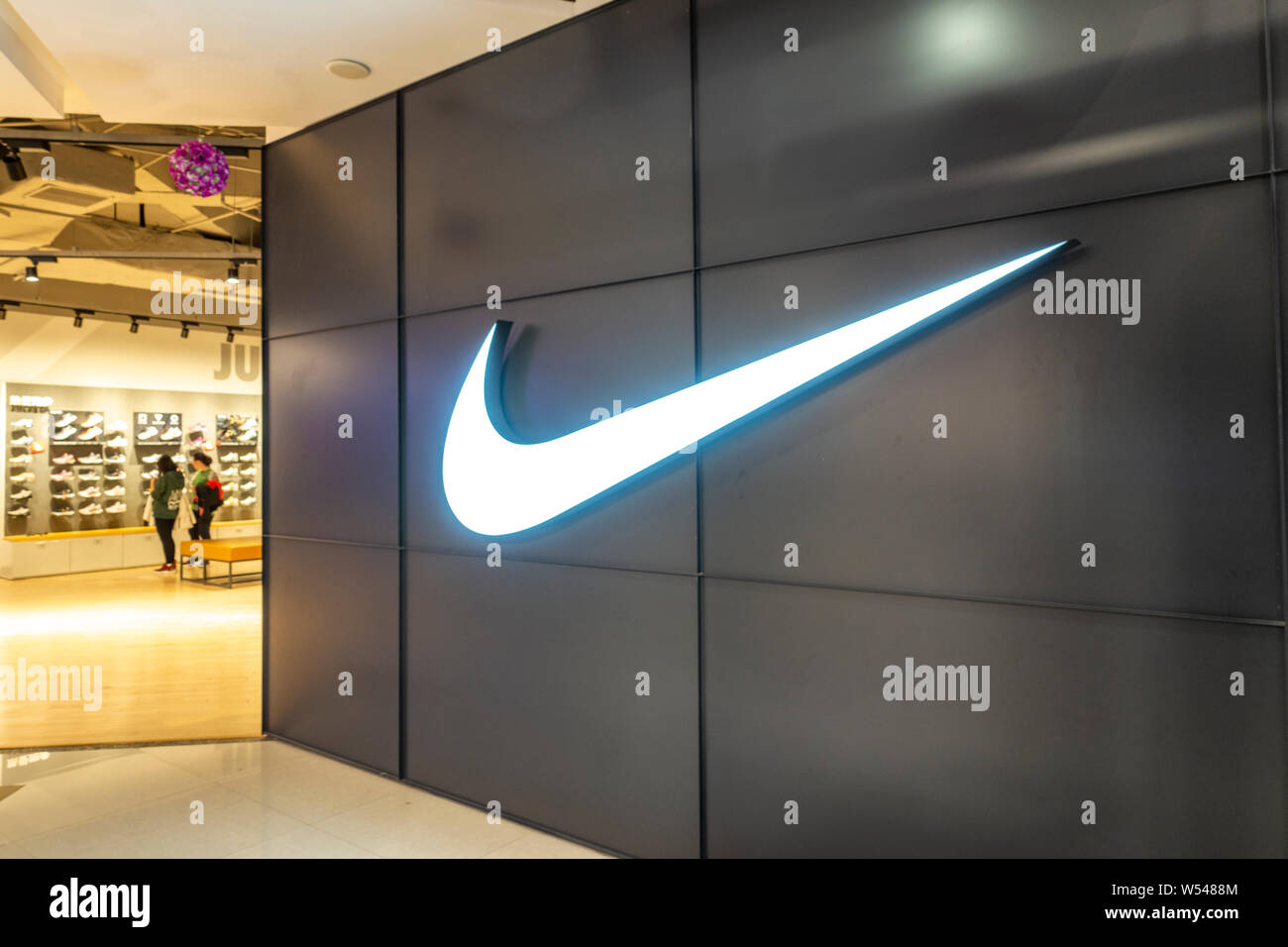 FILE--View of a Nike sportswear store in Shanghai, China, 22 October 2018.  Nike has vowed to remove social barriers and promote women's sneaker cu  Stock Photo - Alamy