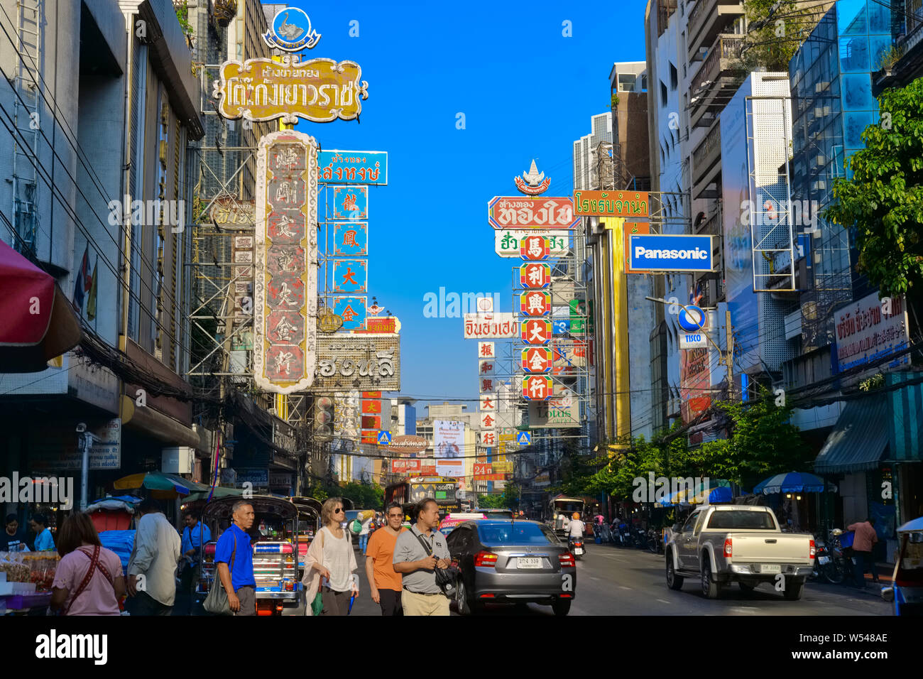 View of Yaowarat Road, the main thoroughfare in Chinatown, Bangkok, Thailand, with shop signs in Thai and Chinese Stock Photo
