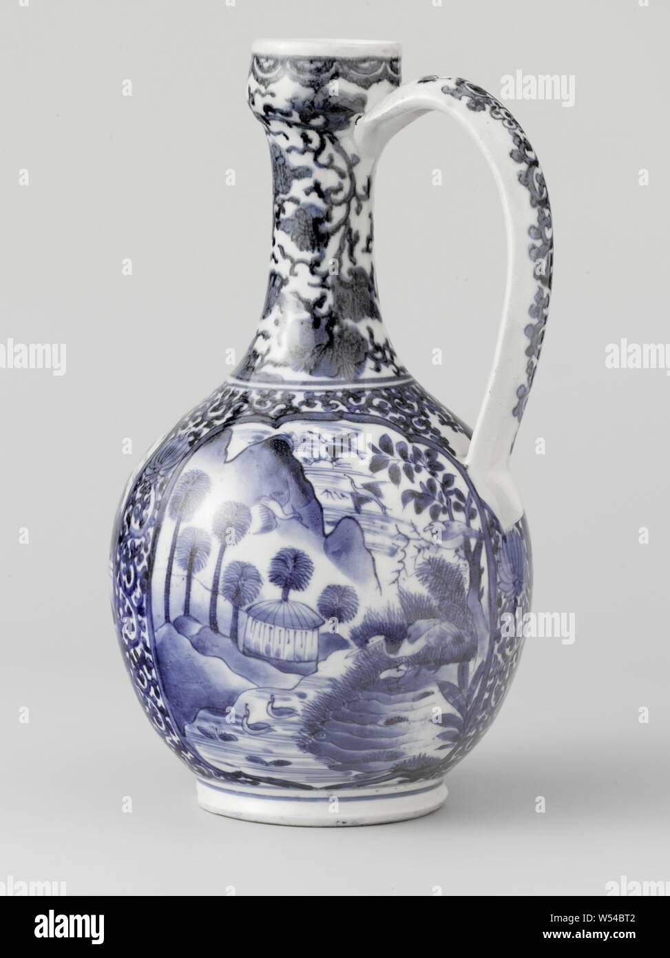 Ewer with landscapes in panels and floral scrolls, Porcelain jug with spherical body, c-shaped ear and small, triangular spout from the rim, painted in underglaze blue. The belly is covered with 'karakusa' tendrils with three scalloped cartouches in it. The middle catouche with two men in a landscape, one with a parasol and a fan, the other with a closed parasol and a dog. To the left of this is a cartouche with cranes in a landscape with trees and rocks. The third cartouche with different birds in a landscape with a pavilion, mountains and a pond. The neck and the ear with flower vines. A Stock Photo