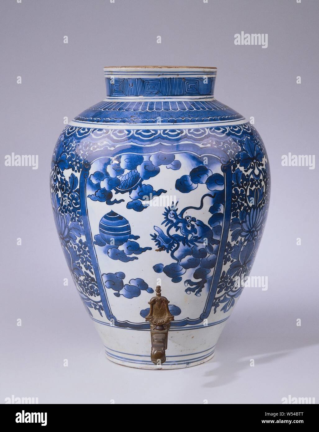 Egg-shaped pot (fountain pot) with rock and plants and flowers, Pot,  underglaze blue, with tap with bedding and swastika motifs. Faucet added  later., anonymous, Arita, c. 1675 - c. 1700 and/or c.