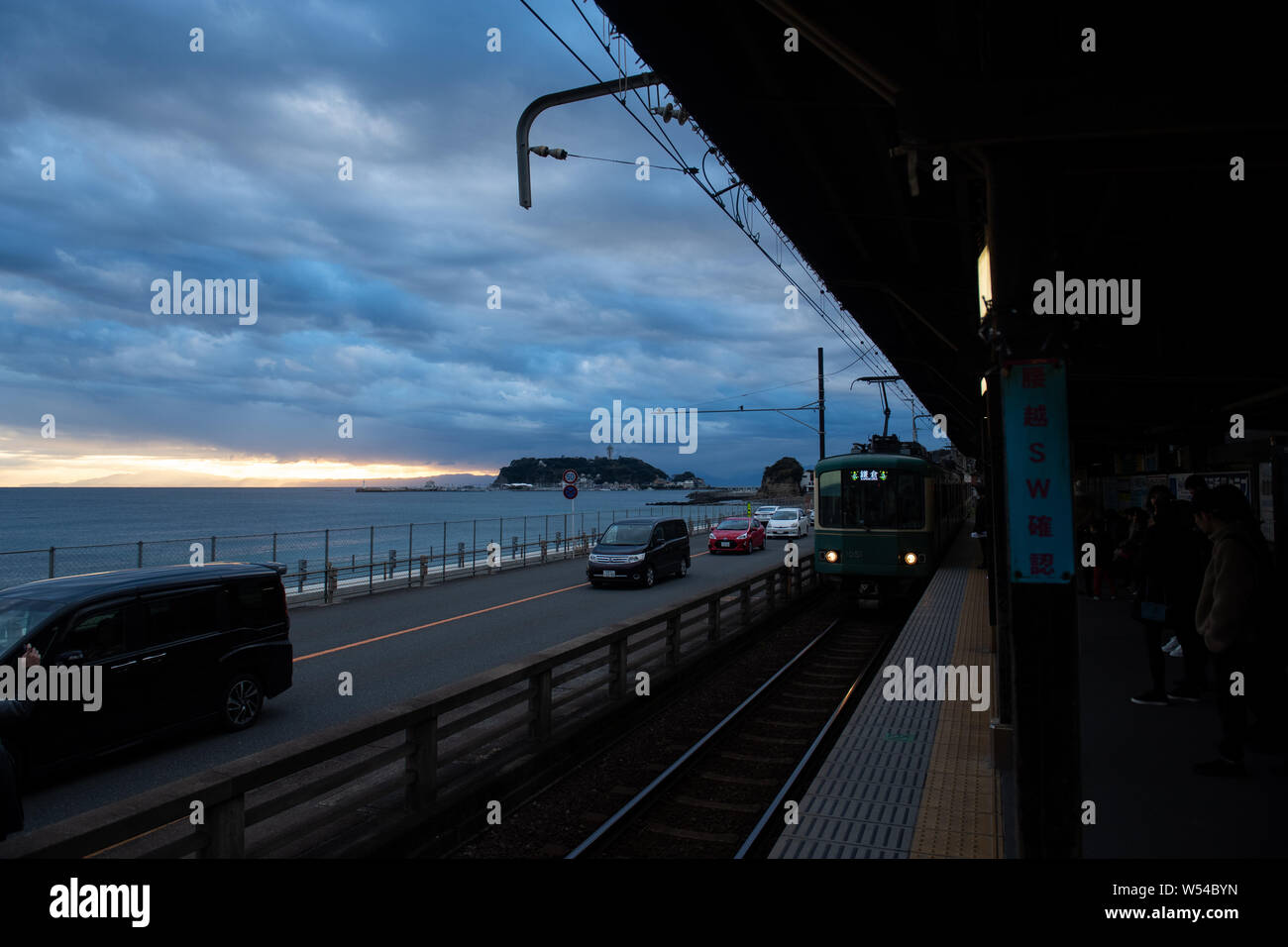 A train on the Enoden Line enters the Kamakura-Koko-Mae Station by the ...