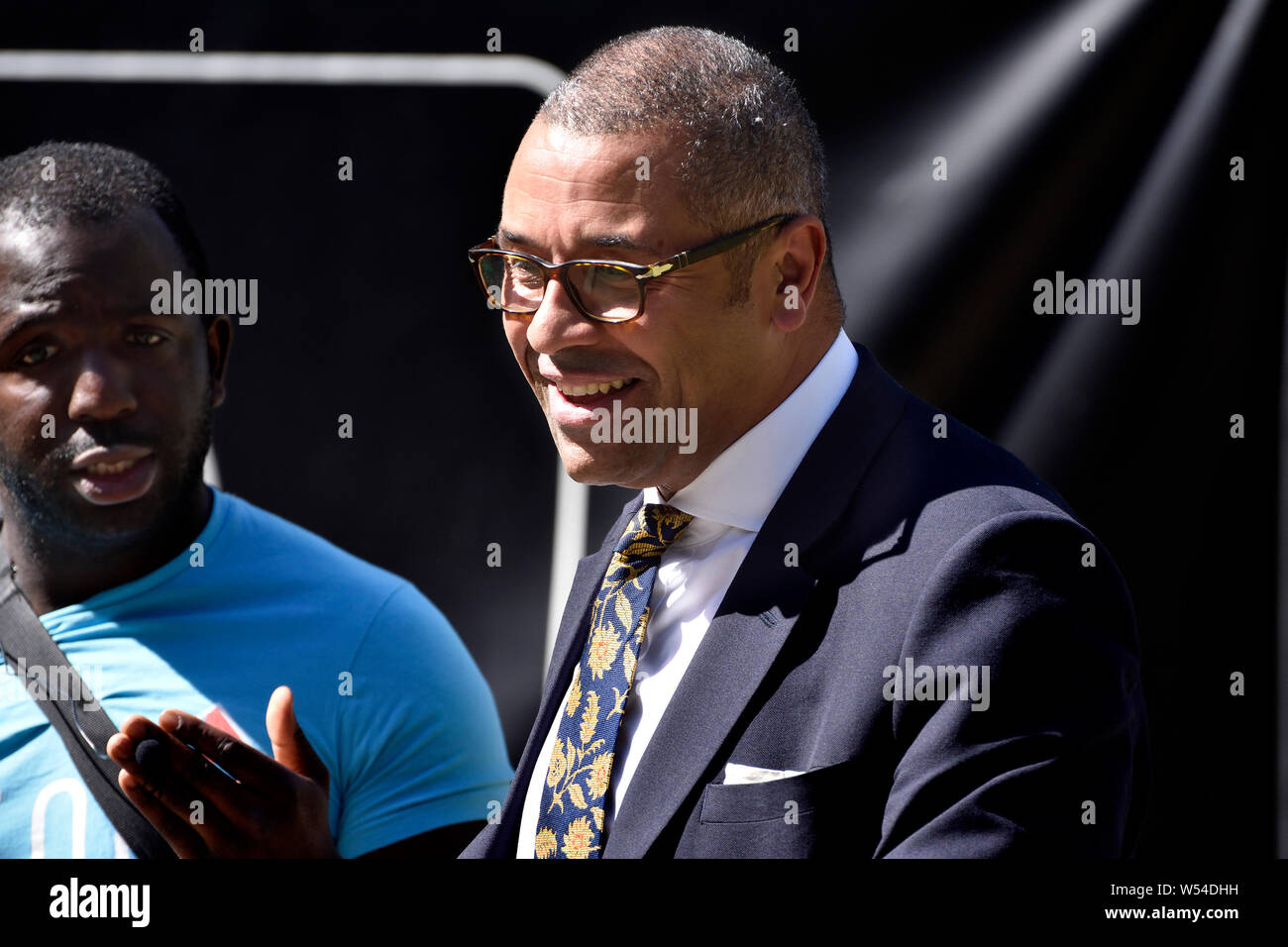 James Cleverly MP (Con: Braintree) Minister without Portfolio - Conservative Party chair - talking to Femi Oluwole - pro-European poilitical activist Stock Photo