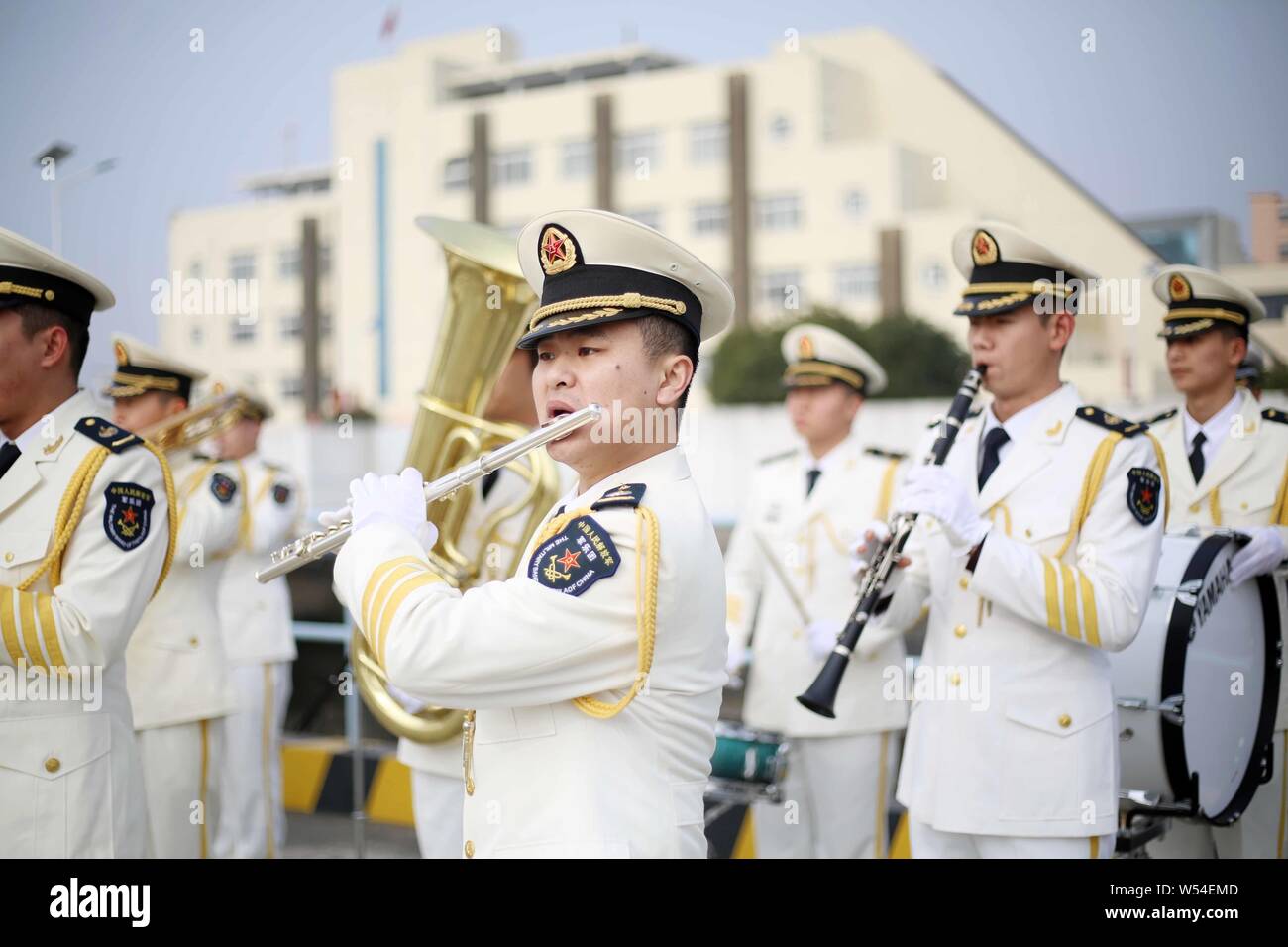 Band members of Chinese naval soldiers perform to welcome South Korean navy at a military port in Shanghai, China, 14 January 2019.   Two ships of the Stock Photo