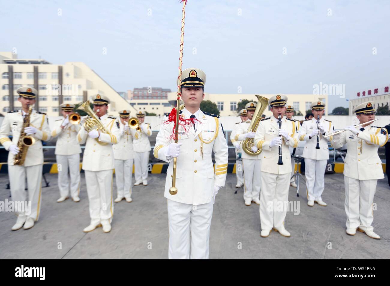 Band members of Chinese naval soldiers perform to welcome South Korean navy at a military port in Shanghai, China, 14 January 2019.   Two ships of the Stock Photo