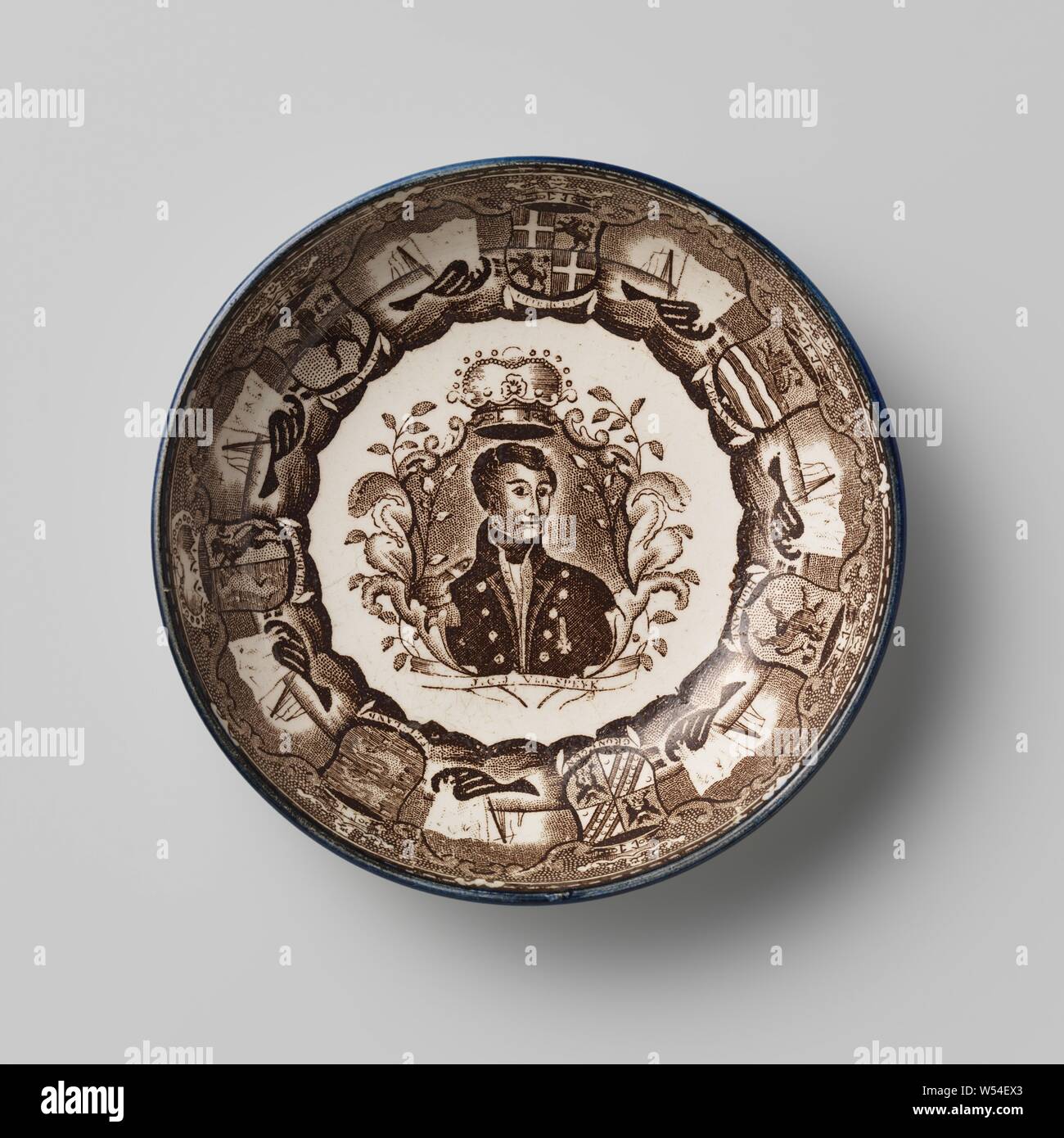 Dish of hard-fired earthenware with a brown transfer as decoration, Dish of hard-fired earthenware. The dish is round and has a representation of a sinking ship and weapons with the names of the provinces as a caption. The dish has an image of a portrait bust with a banderole on which is written JCJ van Speyk. The dish is marked: Scott., Southwick Pottery, Sunderland, c. 1831 - c. 1840, earthenware, d 12.4 cm × h 2.7 cm Stock Photo