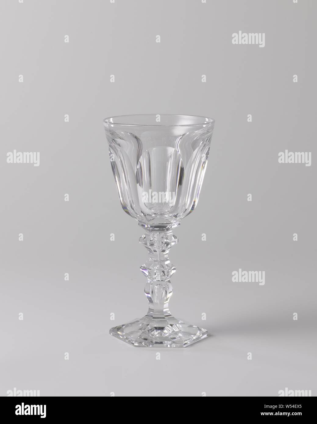 Goblet with cut elips, Hexagonal, conical foot, baluster-shaped trunk with an enclosed bubble and two knots. Conical chalice rounded at the bottom. Faceted cut base and stem, chalice cut into ellipses., anonymous, France, c. 1850 - c. 1875, glass, grinding, h 18.1 cm × d 9.2 cm Stock Photo