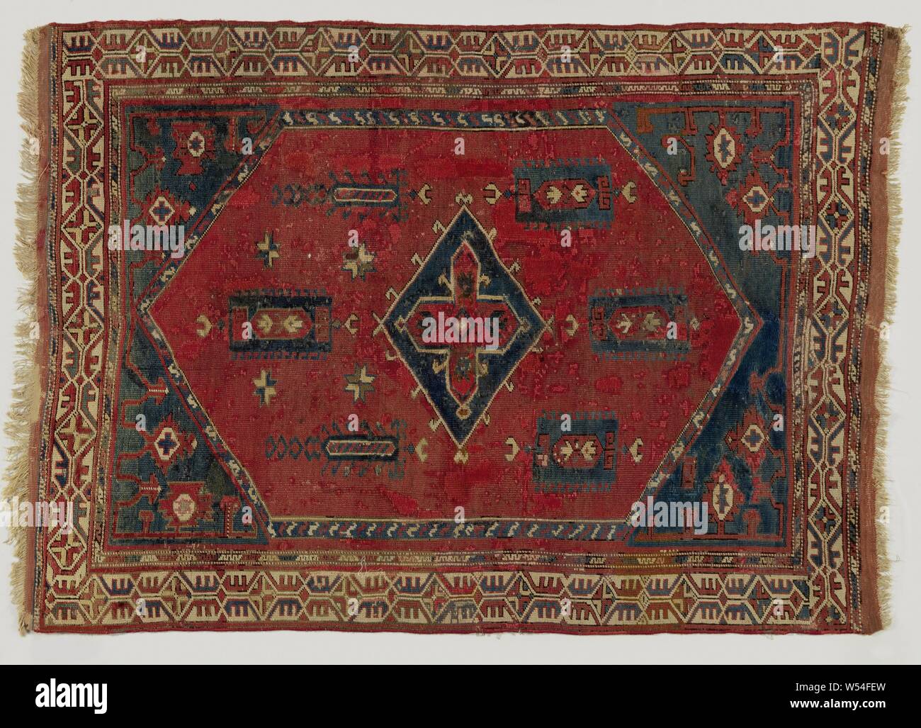 Eastern Carpet Eastern Carpet With A Blue Diamond On A Red Ground