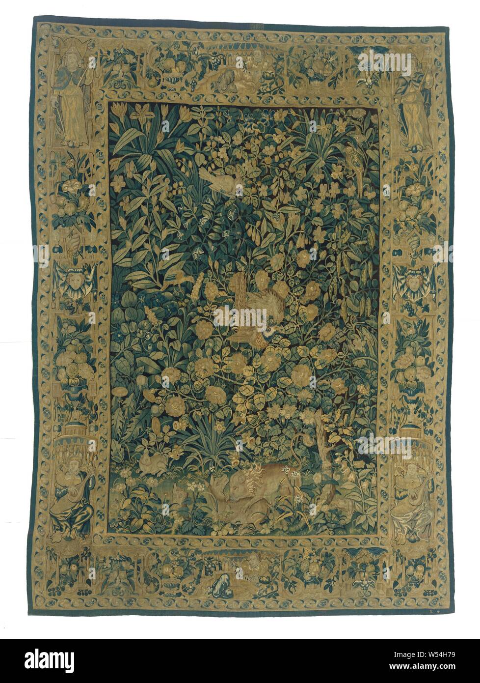 Verdure with animals, Tapestry, small-leafed verdure, with a sparrow hawk attacking a pheasant and a lion leaping a deer, a dog, a hare and three birds, with the Enghien city brand., anonymous, Edingen, c. 1550 - c. 1600, ketting, inslag, tapestry, h 318.0 cm × w 225.0 cm Stock Photo