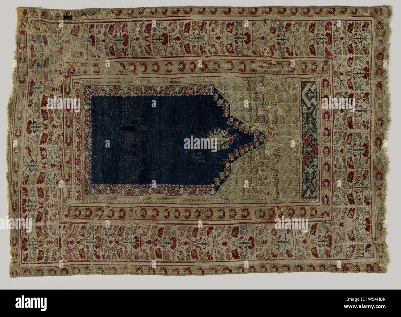 Oriental Carpet Prayer Rug Made Of Knotted Wool Decorated With A Corn Blue Mihrab Pointed And Toothed Top In Which A Stylized Lamp Hangs Beige Sprays With Plant Leaves Around The Midfield Three