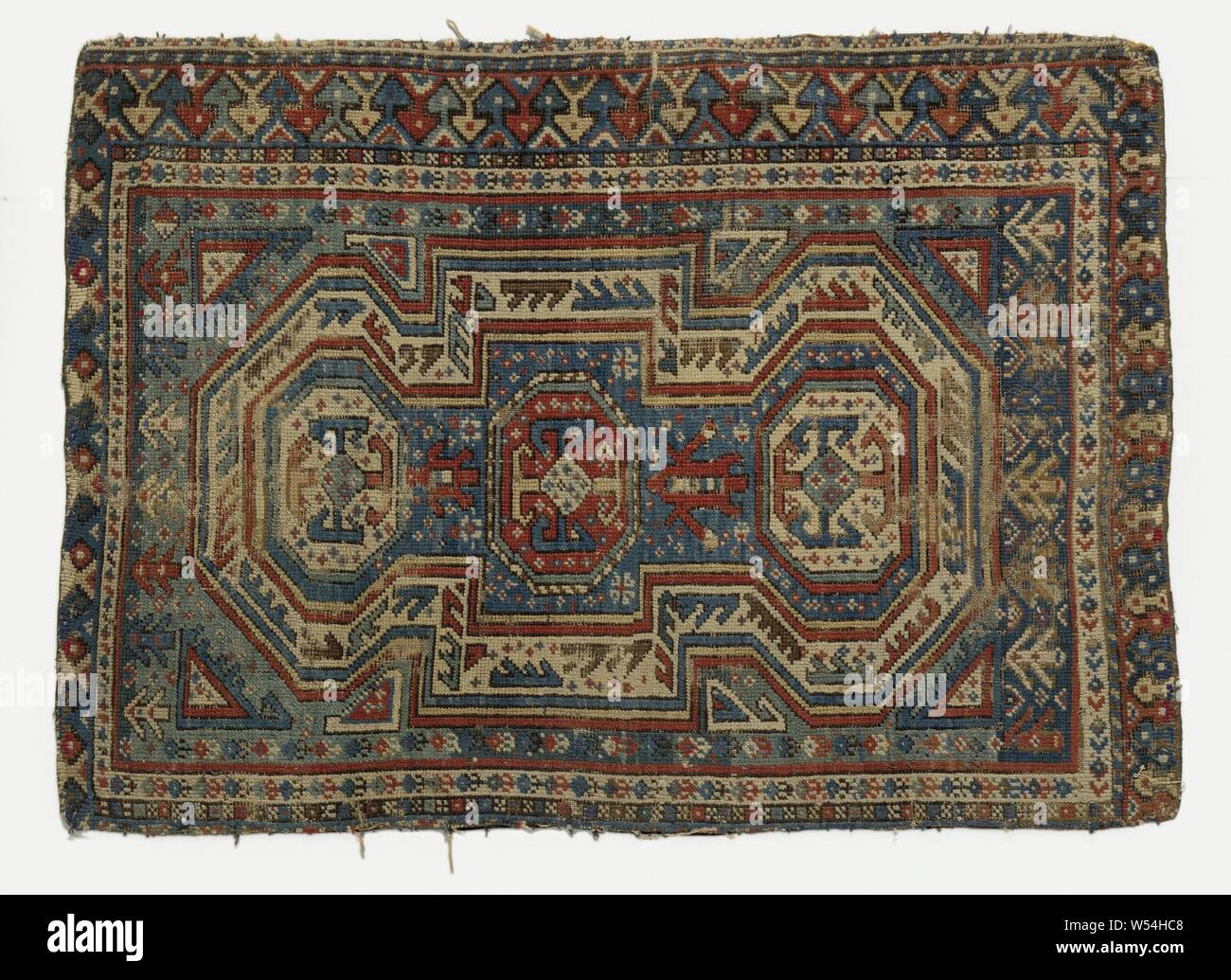 Oriental carpet, presumably prayer rug, made of knotted wool, decorated with a double mihrab with high top facades. Three edges with two seams., anonymous, Shirvan (possibly), c. 1800, wool, h 108 cm × w 78 cm Stock Photo