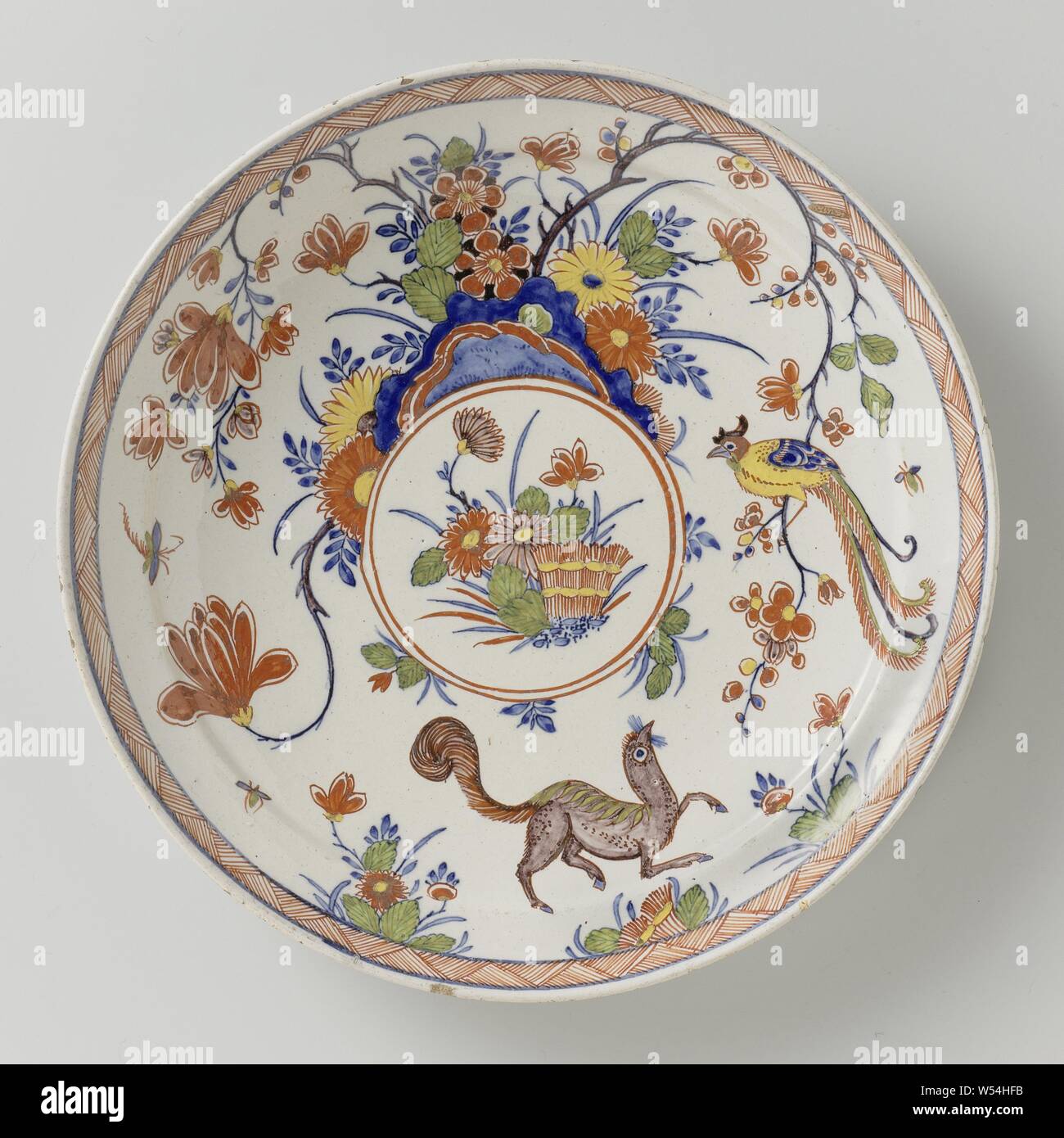 Plate, Plate of faience. Multicolored painted after Japanese Kakiemon example., anonymous, Delft, 1710 - 1740, d 22.8 cm × h 3.0 cm Stock Photo