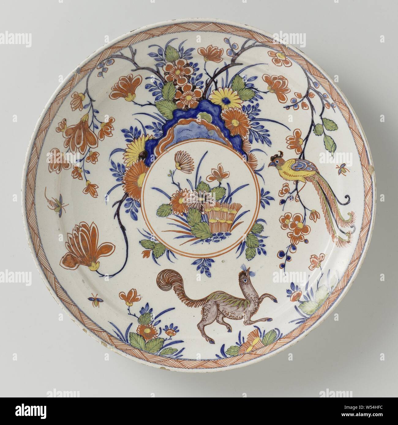 Plate, Plate of faience. Multicolored painted after Japanese Kakiemon example., anonymous, Delft, 1710 - 1740, d 23.1 cm × h 3.1 cm Stock Photo