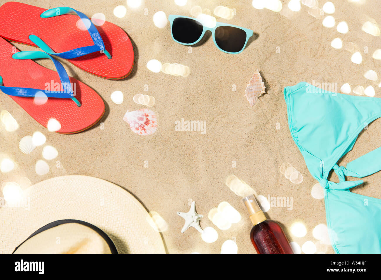 straw hat, flip flops and sunglasses on beach sand Stock Photo - Alamy