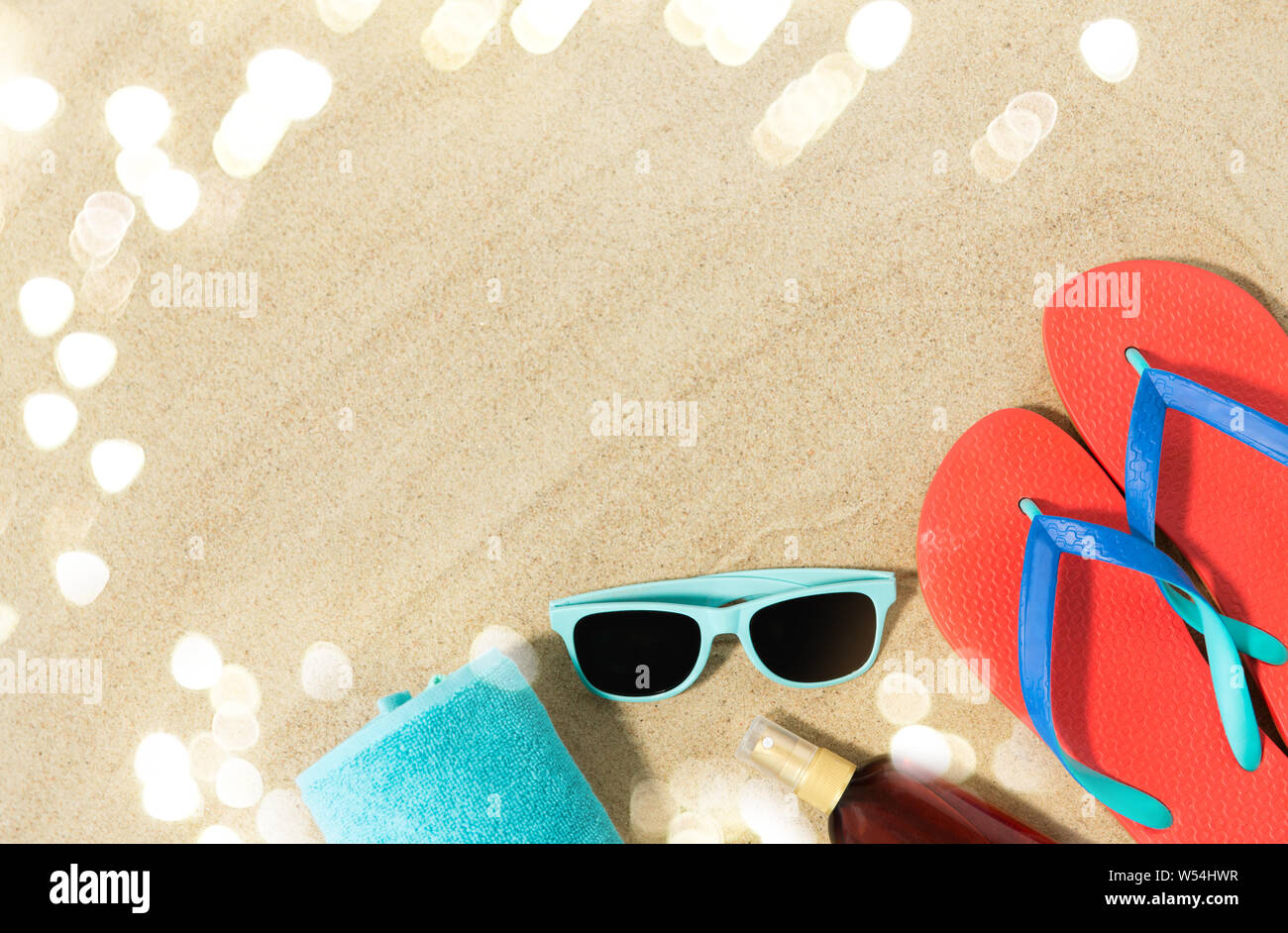 straw hat, flip flops and sunglasses on beach sand Stock Photo - Alamy
