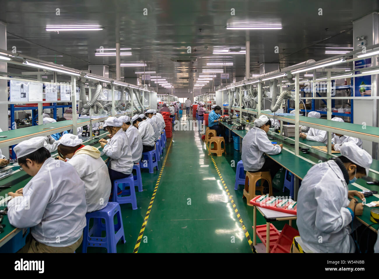 FILEChinese workers manufacture electric products on the assembly