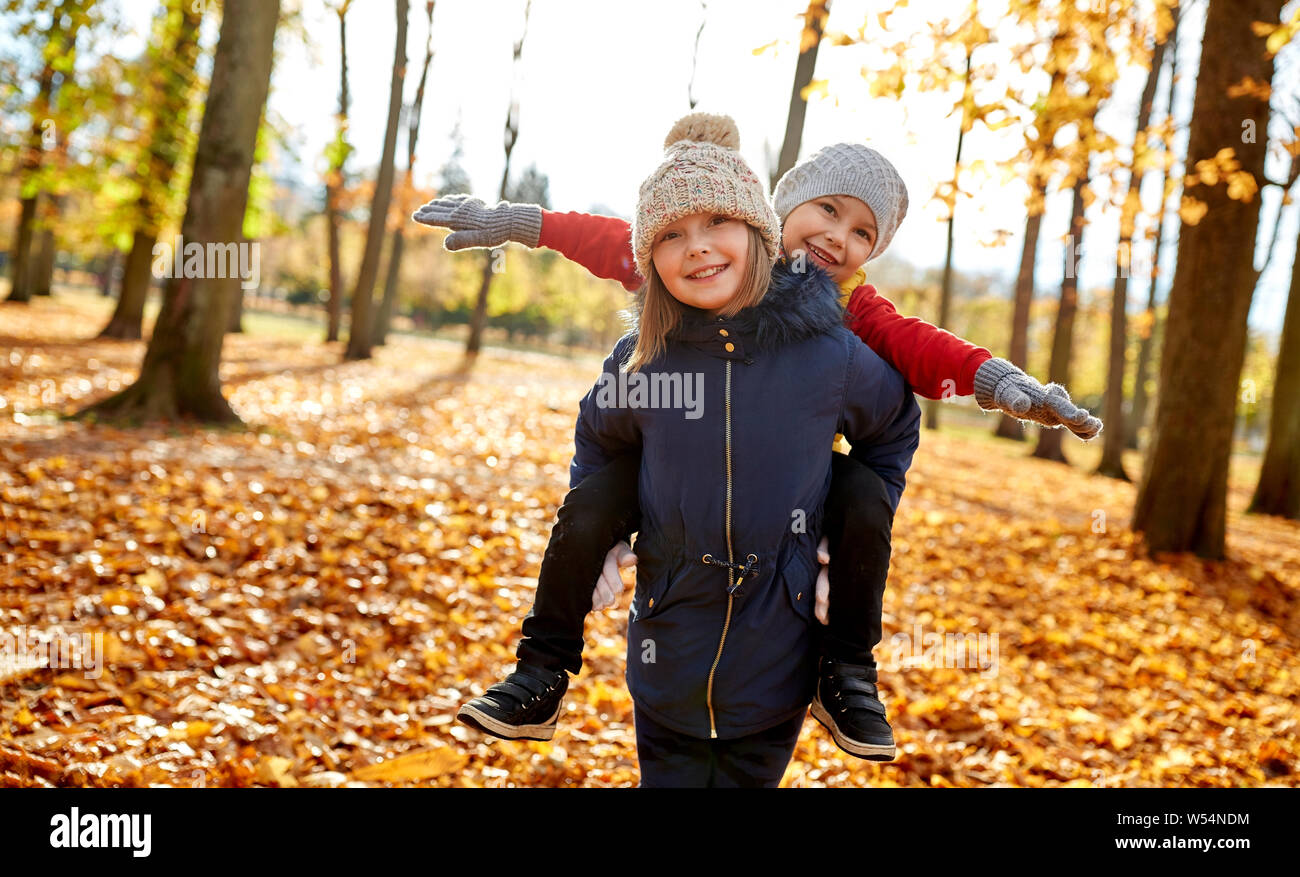 happy children having fun at autumn park Stock Photo - Alamy