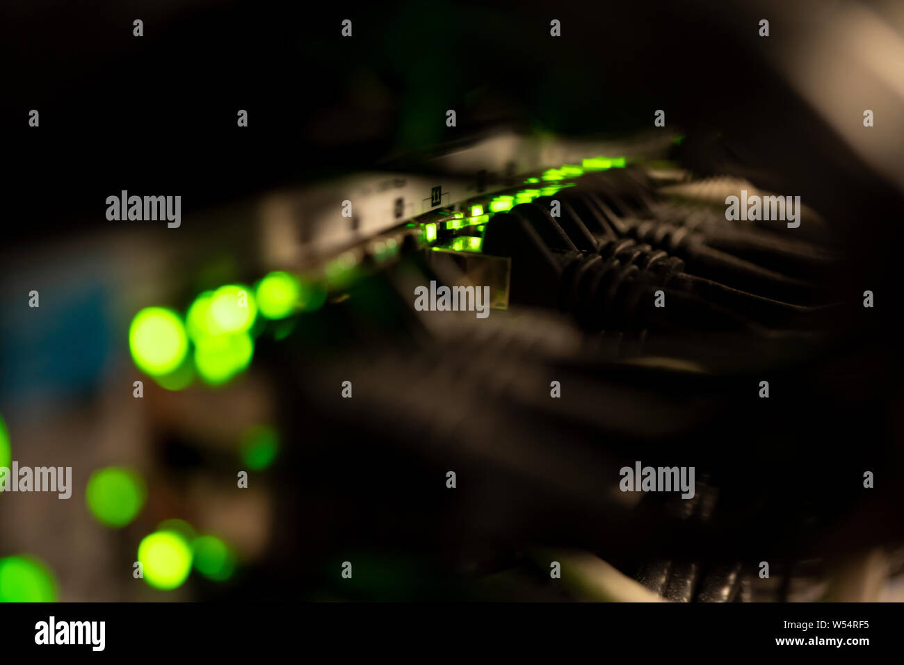 Network Switch and Ethernet Cables Patched into Local Network and IPTV Stock Photo