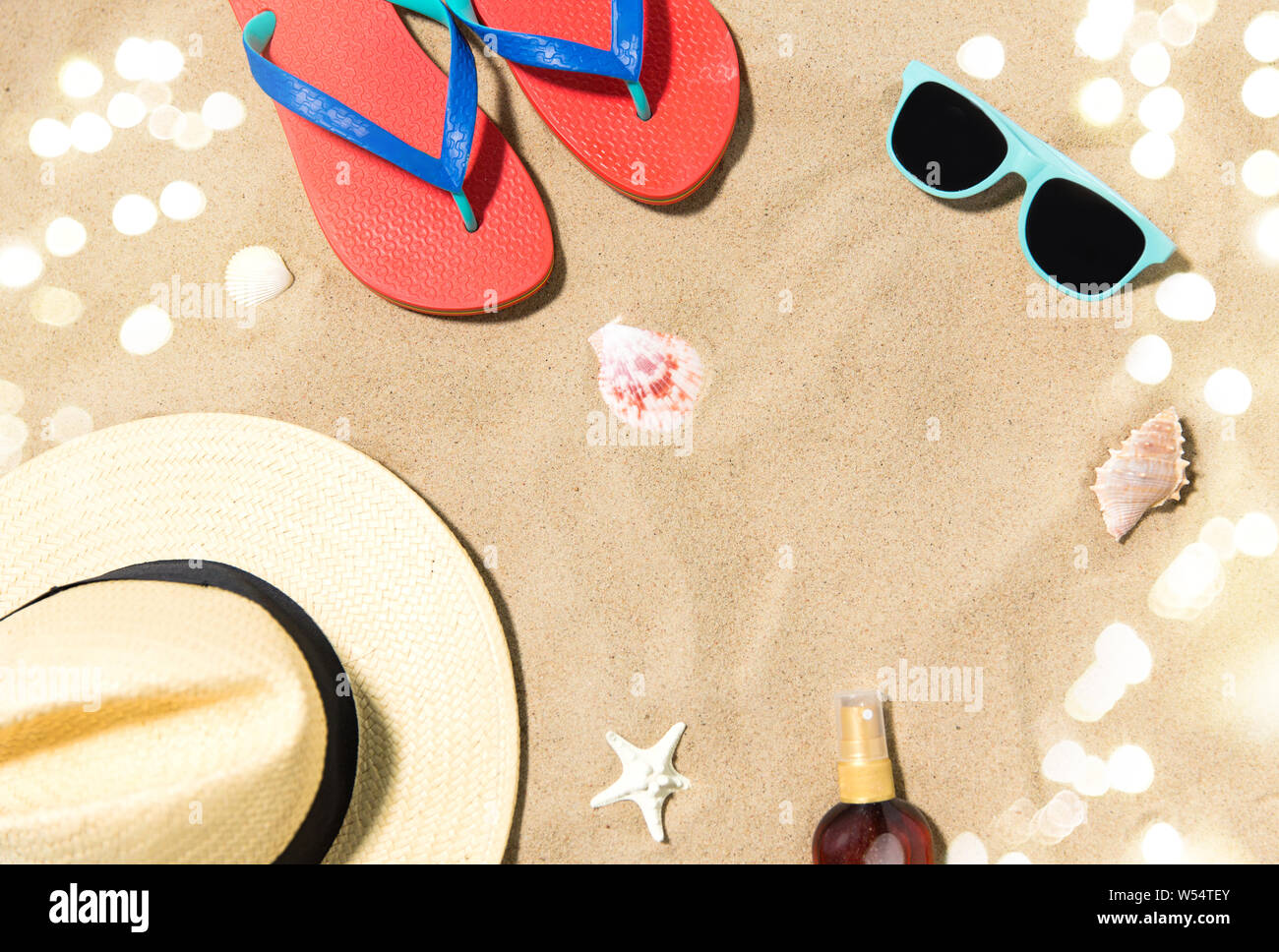 straw hat, flip flops and sunglasses on beach sand Stock Photo - Alamy