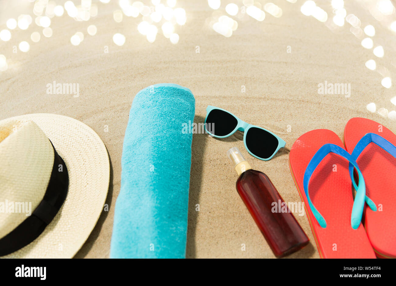 straw hat, flip flops and sunglasses on beach sand Stock Photo - Alamy