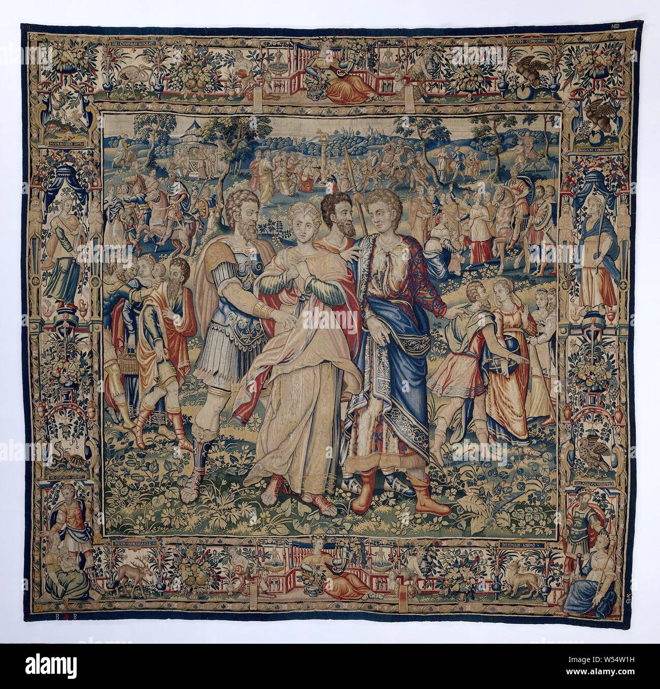 Tobit and Anna in exile to Ninevé The history of Tobit and Tobias (series title), Tapestry with the Babylonian Exile prophesied by Jeremiah (2 Chronicles 36: 20-21) after Nebuchadnezzar's destruction of Jerusalem. Marked with a weaver brand and the Brussels city coat of arms., Frans Geubels, Brussels, c. 1560 - c. 1575, ketting, inslag, tapestry, h 328 cm × w 338 cm Stock Photo