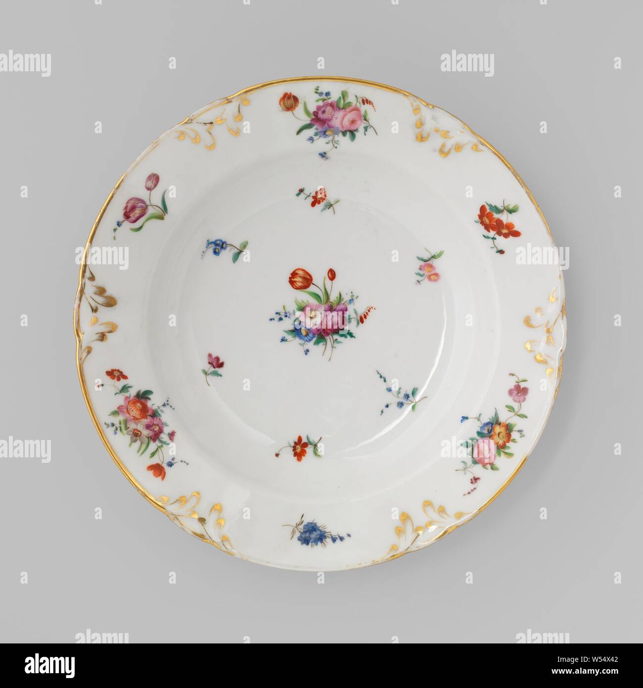 Plate with bouquets and flower sprays, Deep porcelain plate with a lobed edge, painted on the glaze in blue, red, pink, green, yellow, purple, black and gold. On the flat bouquets of different flowers and scatter flowers. From the lobed, golden edge, modeled leaf vines in relief, set with gold. Bouquets in between. Three proen on the bottom. Marked on the bottom with 'DENUELLE / Boulevard St. Denis 18 / à Paris'., Fabriek Dominique Denuelle, Paris, c. 1839, porcelain (material), glaze, gold (metal), vitrification, h 4.4 cm d 23.7 cm d 13.7 cm Stock Photo