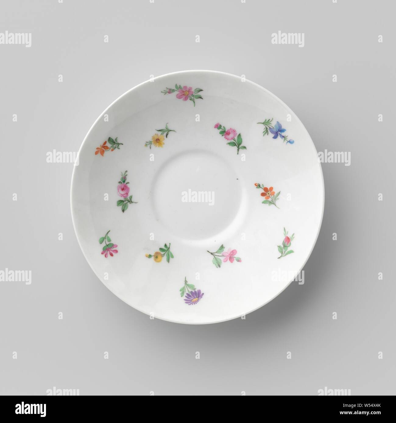 Saucer with flowers, Porcelain dish, painted on the glaze in blue, red, pink, green, yellow, purple and black. The inner wall is covered with small scatter flowers. The reverse side is decorated. Marked on the bottom with the scepter, the red apple with K.P.M and the year letter N (1913) and I., Königliche Porzellan Manufaktur, Berlin, c. 1913, porcelain (material), glaze, vitrification, h 3.2 cm d 14.6 cm d 7 cm Stock Photo