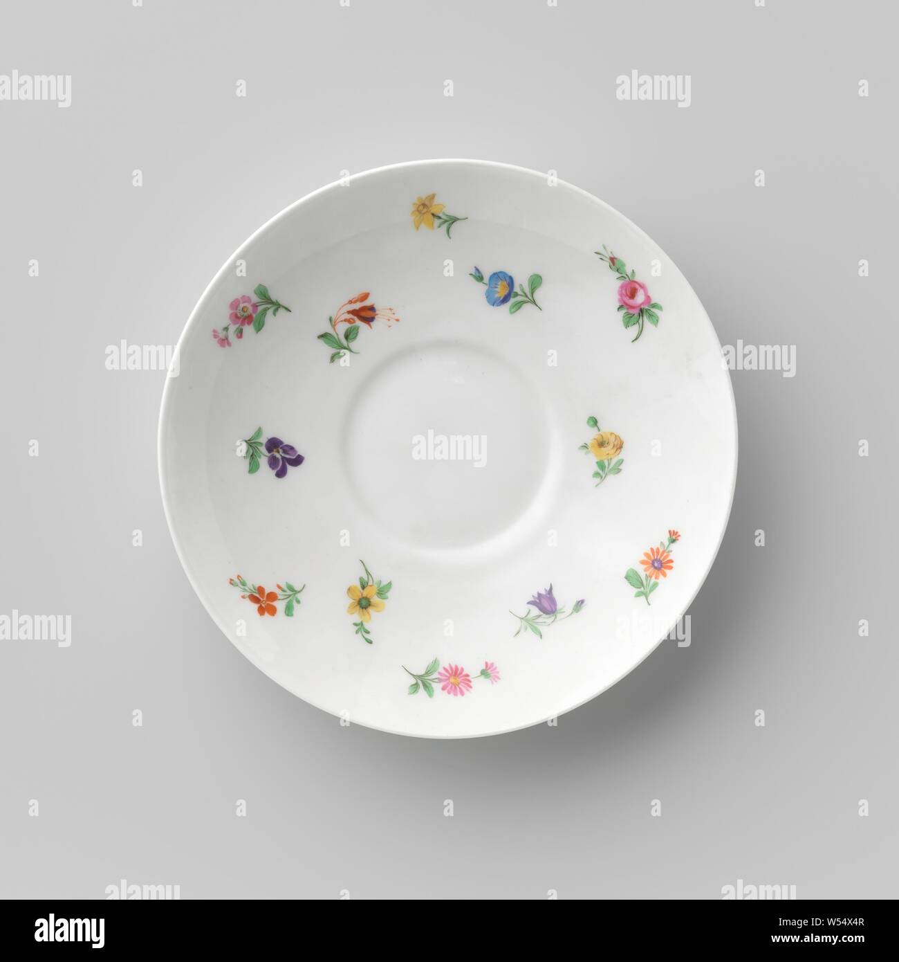 Saucer with flowers, Porcelain dish, painted on the glaze in blue, red, pink, green, yellow, purple and black. The inner wall is covered with small scatter flowers. The reverse side is decorated. Marked on the bottom with the scepter, the red apple with K.P.M and the year letter N (1913) and I., Königliche Porzellan Manufaktur, Berlin, c. 1913, porcelain (material), glaze, vitrification, h 3.2 cm d 14.6 cm d 6.8 cm Stock Photo