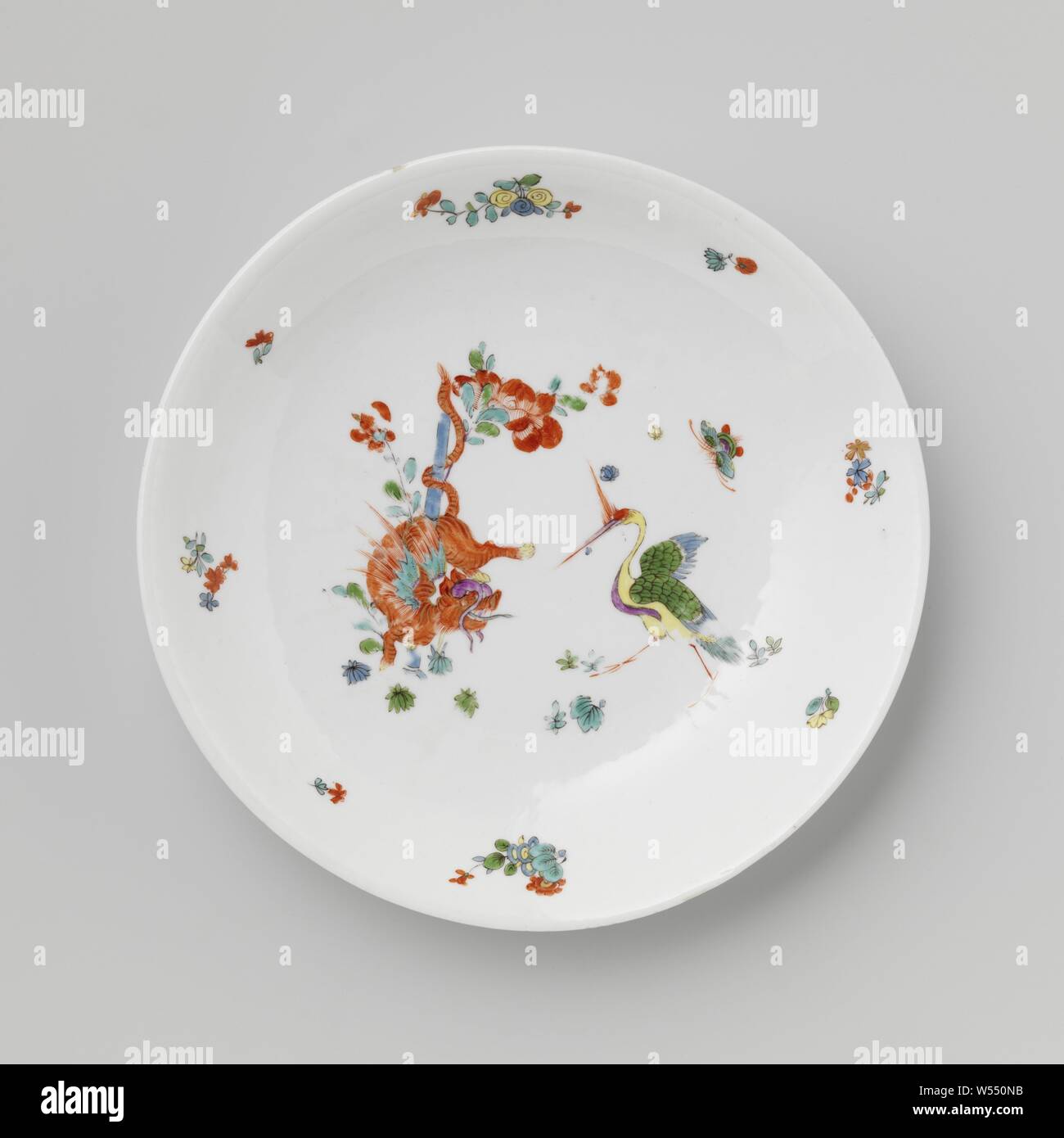 Dish, multicolored painted with a Kakiemon decor, Round deep dish of painted porcelain. The bowl is painted with a winged tiger around a bamboo stem with a peony on the left and a crane on the right. The scale is marked., Meissener Porzellan Manufaktur, Meissen, c. 1730, porcelain (material), h 4 cm × d 22.8 cm Stock Photo