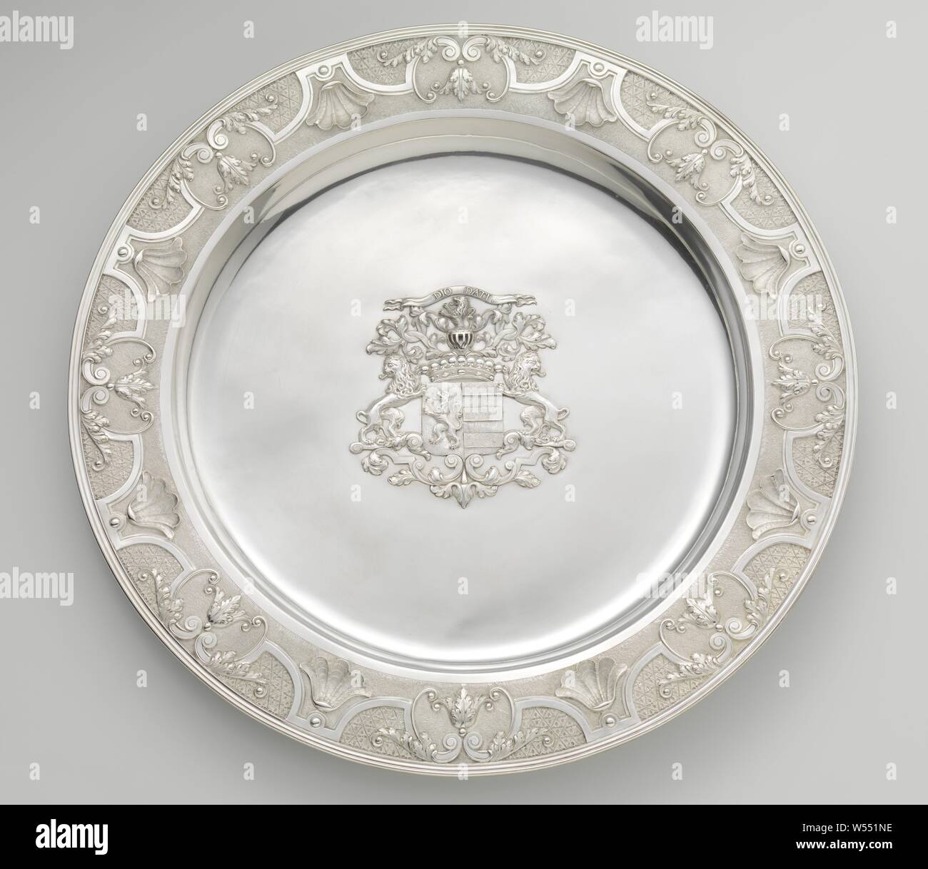 Communion set Supper dish, Supper dish of silver. The border is decorated with Louis XIV ornament borders. The appliqued weapon of Philip Diodati, armorial bearing, heraldry, is mounted in the center of the shelf, Dirk Wor (attributed to), Dordrecht, 1736, silver (metal), d 50.2 cm Stock Photo