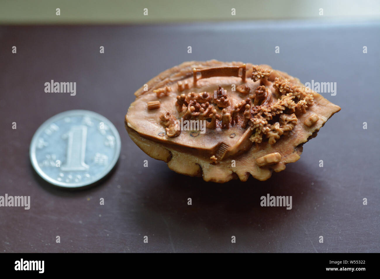 A Micro Sculpture Carved On A Peach Pit By Chinese Artist Li Yanjun Is On Display At His Home In Mayuzi Village Zhailihe Town Juxian County Rizhao Stock Photo Alamy
