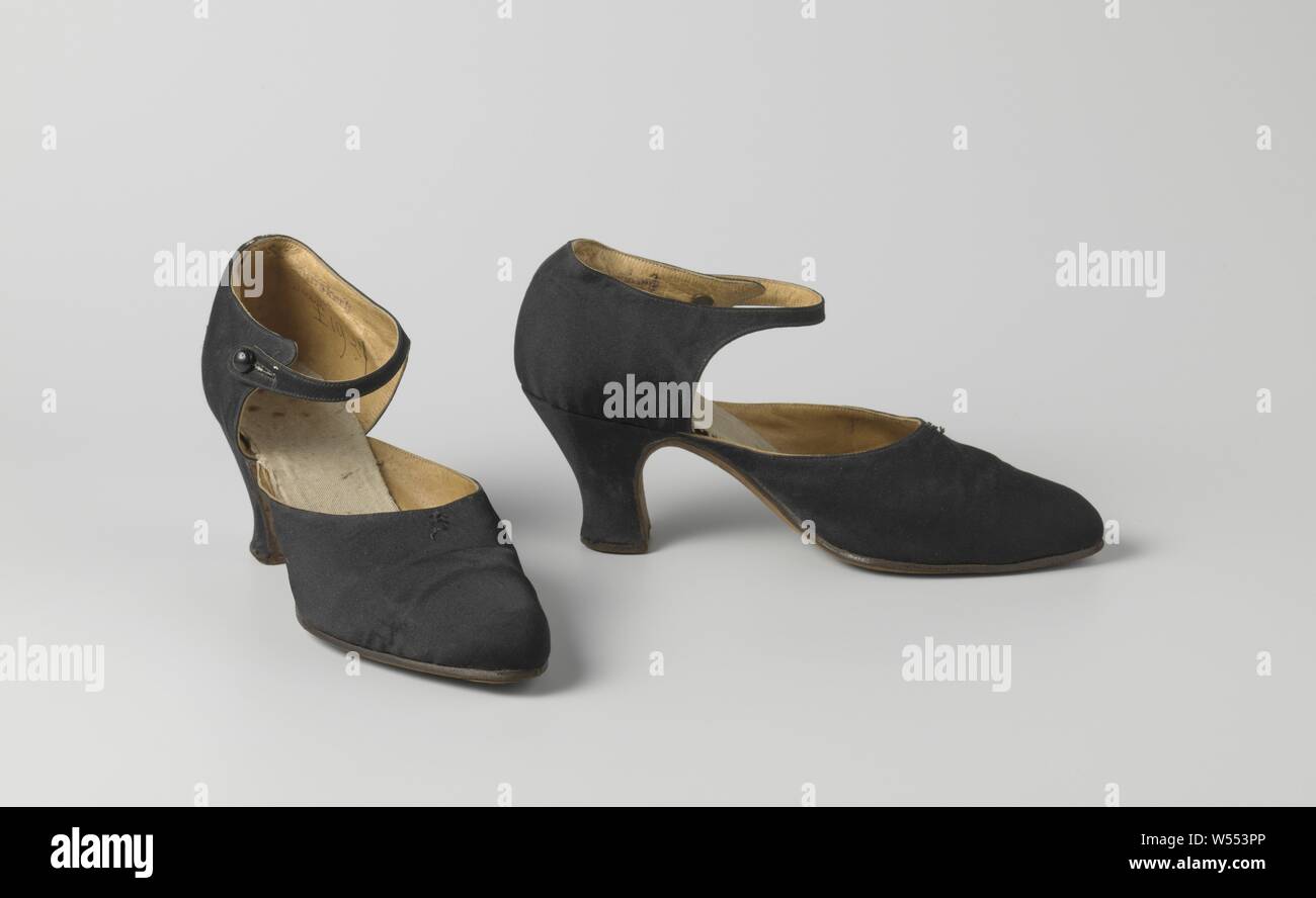 Black satin strap shoe with ankle strap, Black satin ladies shoe with ankle  strap. Model: The rounded pointed nose, one front sheet and two side  sheets. The cut-out of the cover runs