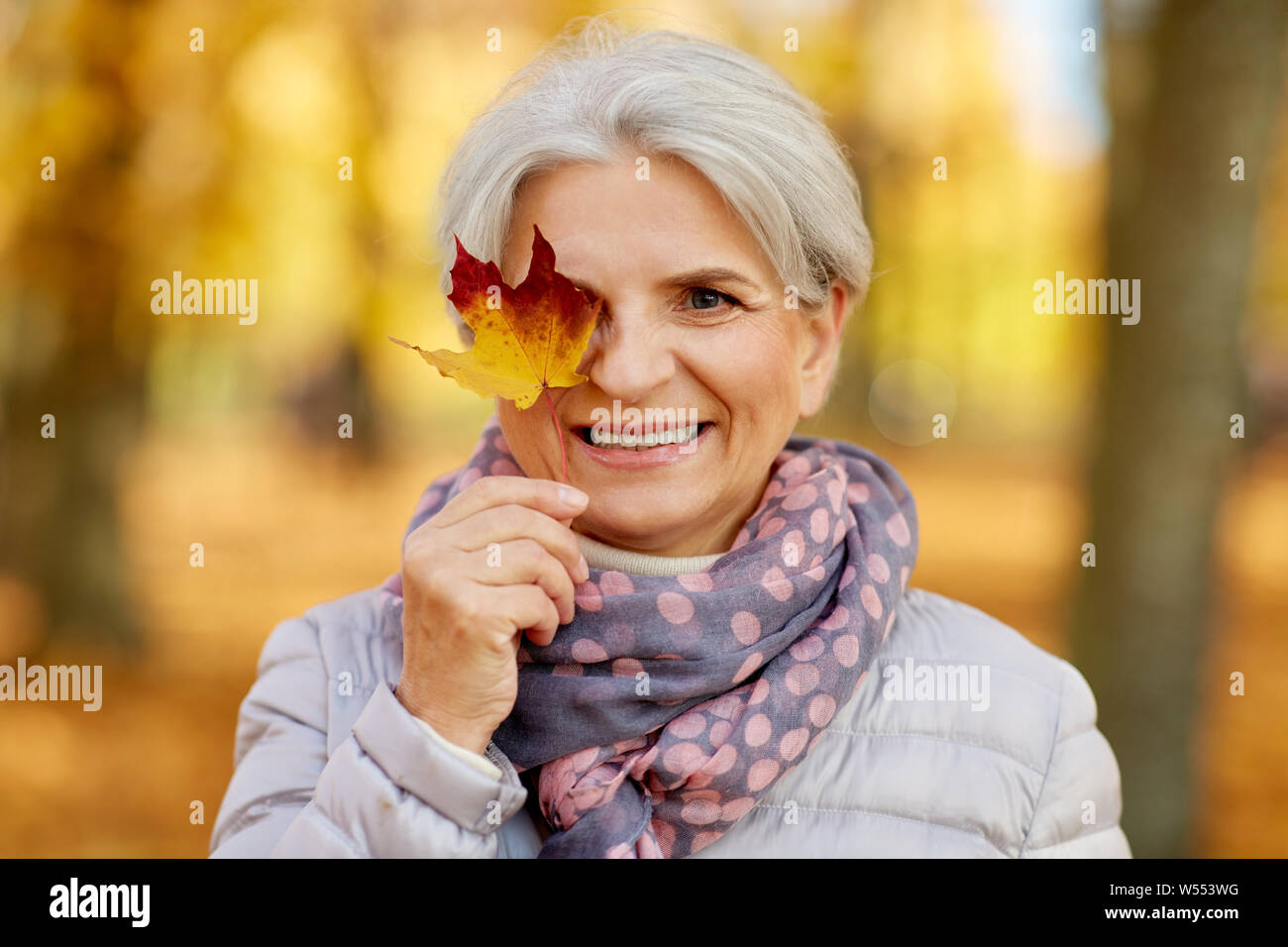 Mature woman autumn leaf hi-res stock photography and images - Alamy
