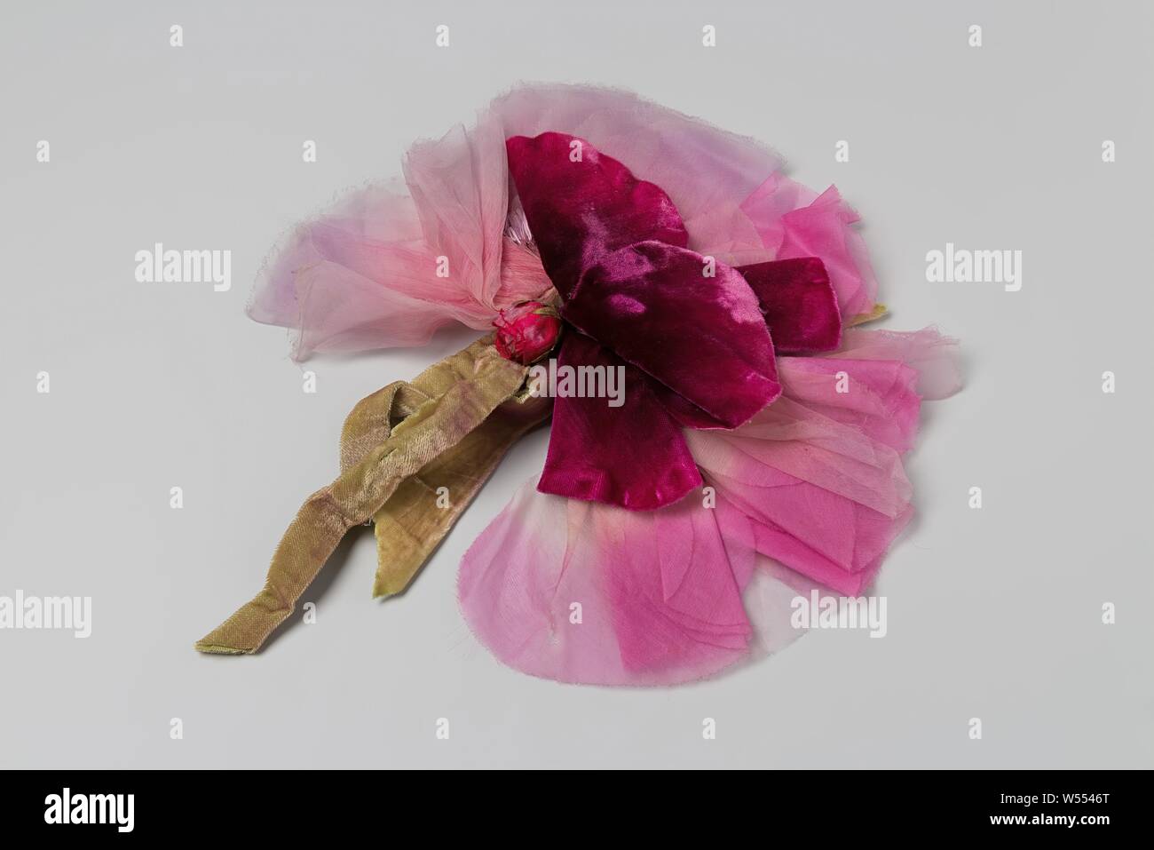 Corsage of pink velvet and silk roses and mesh with green velvet