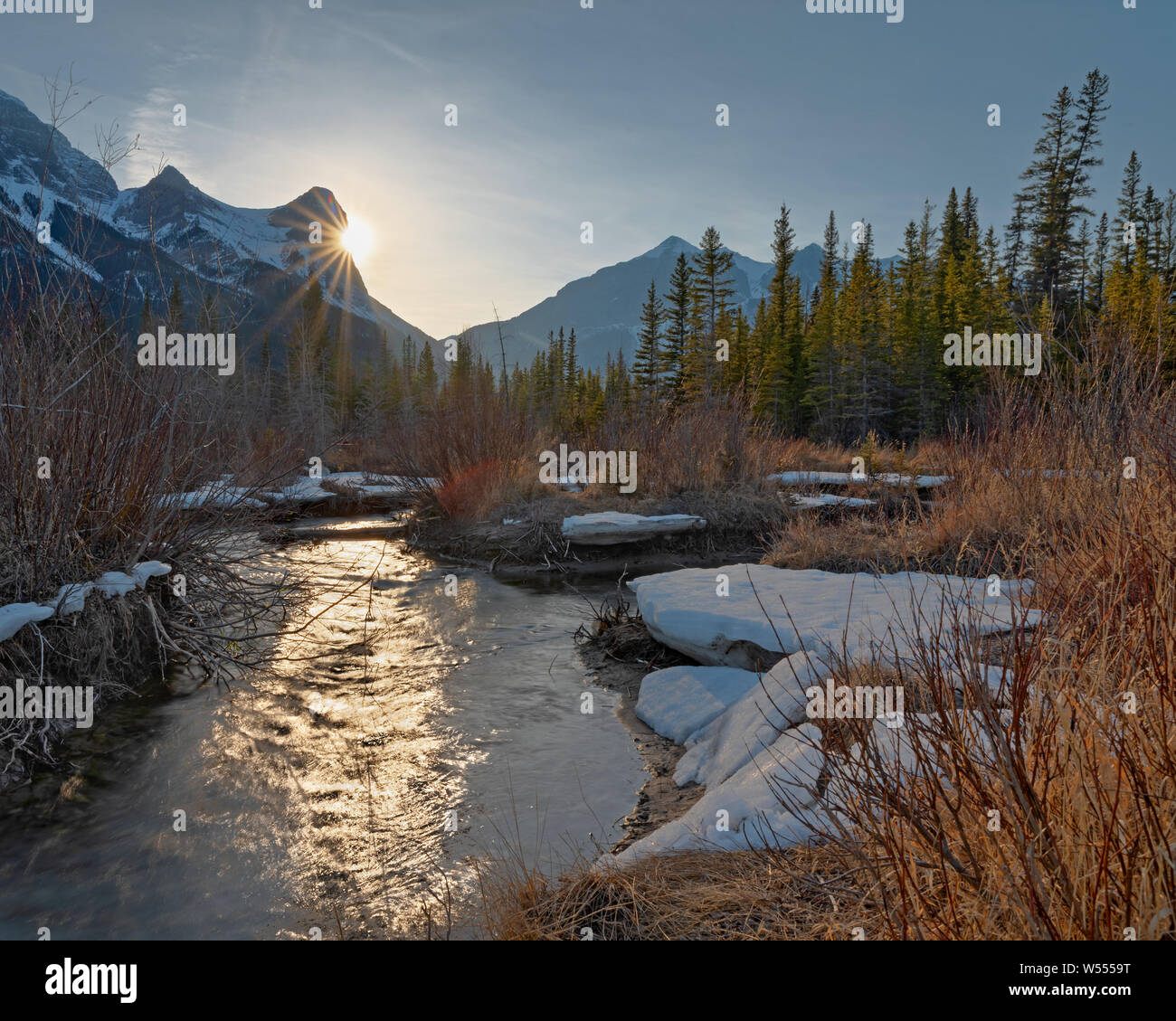 Sun Setting behind Ha Ling Peak in Canmore, Alberta, Canada Stock Photo