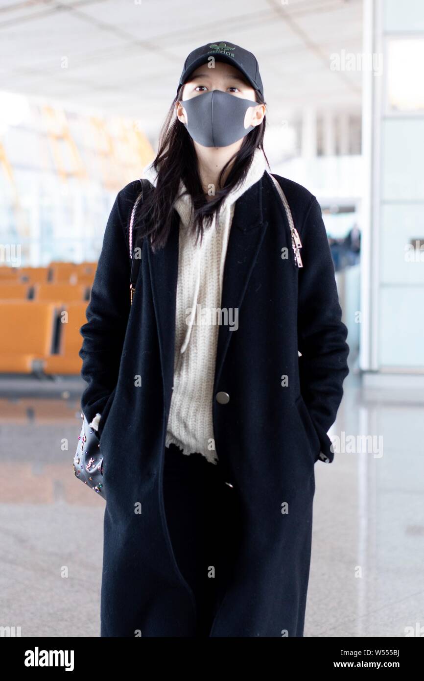 Chinese actress Guan Xiaotong arrives at an airport in Shanghai, China, 20  February 2019. Hat: adidas Handbag: Yves Saint laurent Stock Photo - Alamy