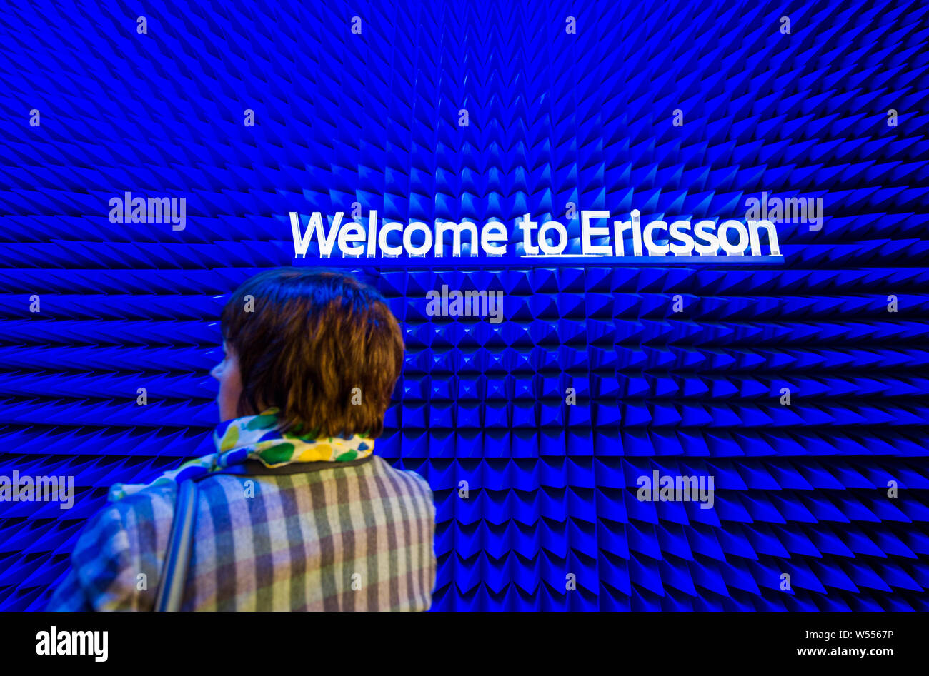 A visitor walks past the stand of Ericsson during the Mobile World Congress 2019 (MWC19) in Barcelona, Spain, 25 February 2019. Stock Photo