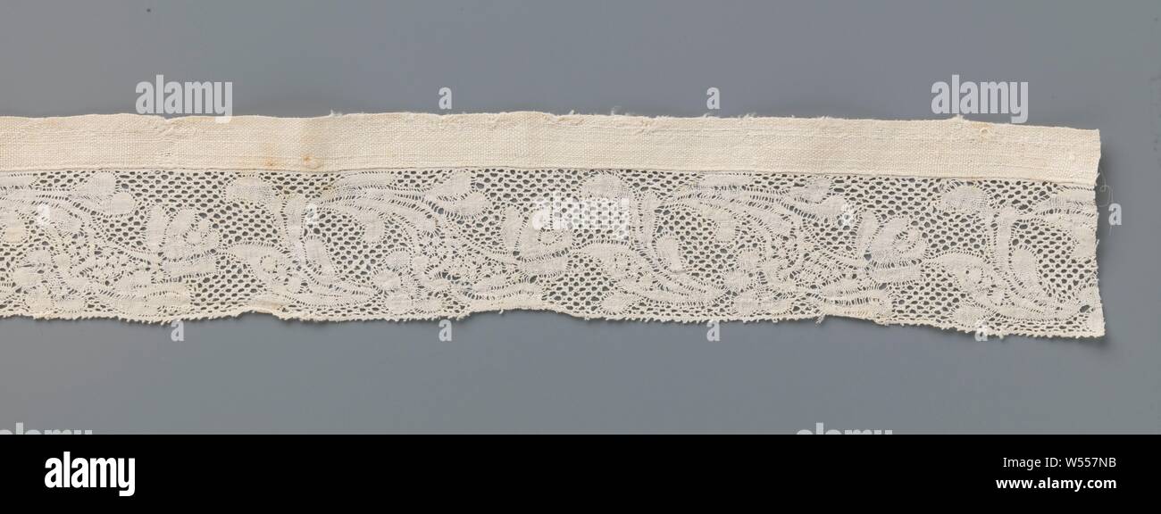 Bobbin lace insert with two different types of flowers on a splicing stem, Natural stripe lace, old Flemish lace. The repeating pattern consists of a flower stem with two different flowers, which split off in the opposite direction along the underside. A number of elongated leaves spring from the lobed flower that bends back in the direction of the stem. These leaves partly bend towards the end of the stem and partly the other way, where it touches the top tulip-like flower in the subsequent pattern. The motifs are connected by a lattice ground, a five-hole ground. The full work is largely Stock Photo