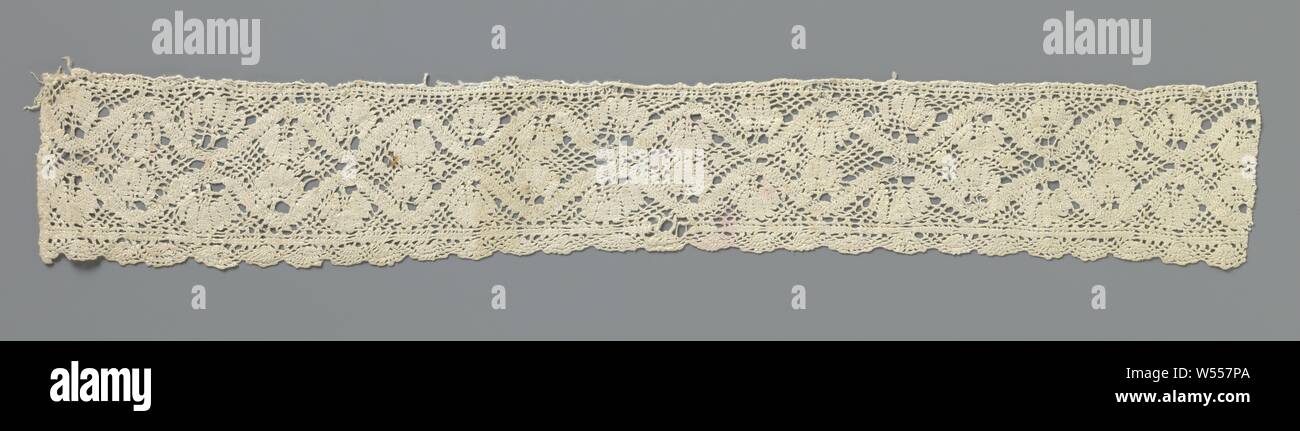 Strip of bobbin lace with fan-shaped leaves between wavy lines, Strip of natural-colored bobbin lace. The repeating and continuous pattern consists of two wavy lines, which together form rounded diamond-shaped fields. A fan-shaped leaf hangs or stands in every wave top and in every wave valley. The motifs are connected by a diamond-shaped mesh soil. The motifs are made in linen with cutouts. Along the underside of the strip runs under a straight edge in linen a scallop edge of concatenated fan motifs. The top is finished with a simple straight decorative border. One of the short sides is Stock Photo