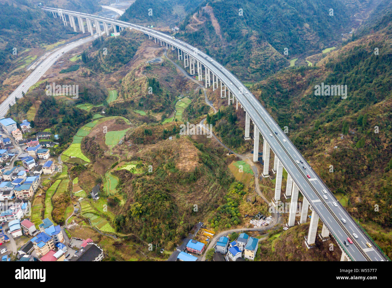 Cars move slowly on the Aizhai Bridge, a suspension bridge on the