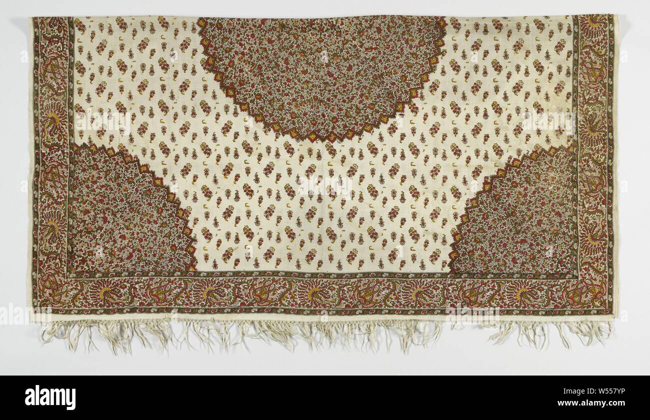 Square scarf, with on a cream colored background a pattern of red and yellow flowers, in the middle a round medallion, inside a frame with fantasy pattern, Square palm scarf of printed wool with a white background and colorful pattern.. In the middle a round medallion in wine red, lilac, dark moss green and gold ocher. Quarter medallions and a narrow border in the corners. The sprinkled botas in the field stand upright and in staggered rows. Versatile intermediate motifs are smaller than the botas. The medallion and the corners are symmetrical, even on eight rays. In the middle an eight Stock Photo