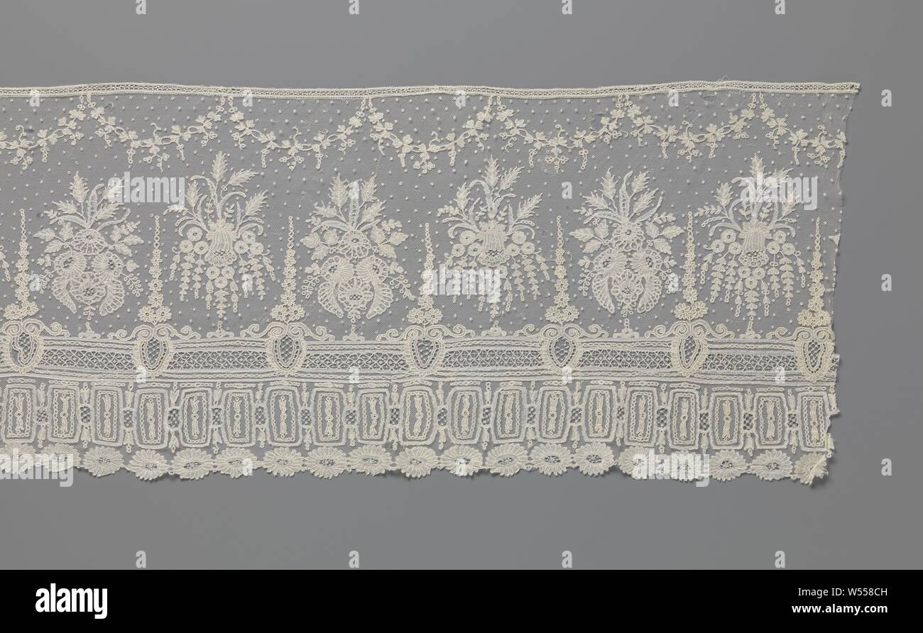 Strip of application lace with bouquets and triple ornament border, Strip of natural colored application lace: bobbin lace with needle edge details appliqued on machine tulle. A repetitive motif with two different bouquets stands on a fine hexagonal mesh ground, with a pattern of rings. One bouquet consists of one bellflower surrounded by nine smaller rosette flowers and long hanging leaves. The other bouquet consists of four large rosette flowers surrounded by branches with leaves. The three ornament borders consist of top to bottom: a straight band with needle stitching stitches, regularly Stock Photo