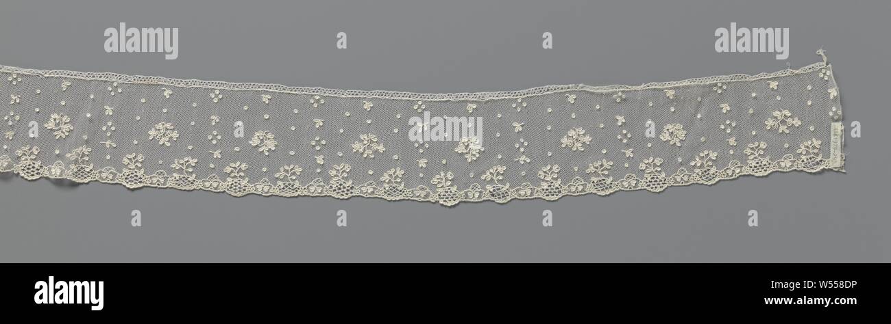 Strip of needle lace with sleeves around flower sprays with oval leaves, Strip of natural colored needle lace: Alençon lace. Scatter motif on a fine hexagonal mesh ground, with two different flower branches along the center line, with many oval leaves. The flower sprays are surrounded with a clear pattern of pulps and twigs with three leaves. The pattern at the bottom of the strip consists of a succession of ovals, a five-leaf flower and intersecting arches that end with heart-shaped leaves. Flower twigs spring from the ovals filled with decorative grounds. The bottom is finished Stock Photo