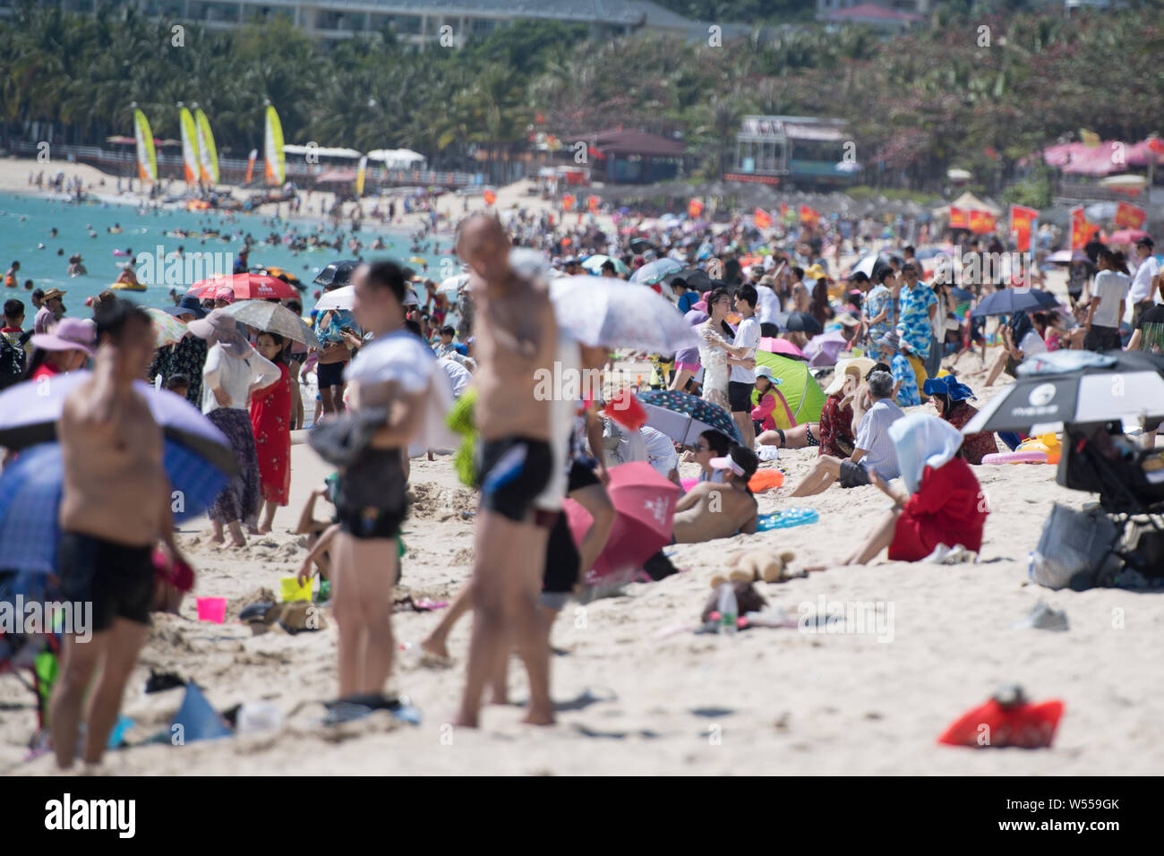Tourists crowd a beach resort at the Dadonghai scenic spot in Sanya city, south China's Hainan province, 14 February 2019.   Dadonghai, one of the mos Stock Photo