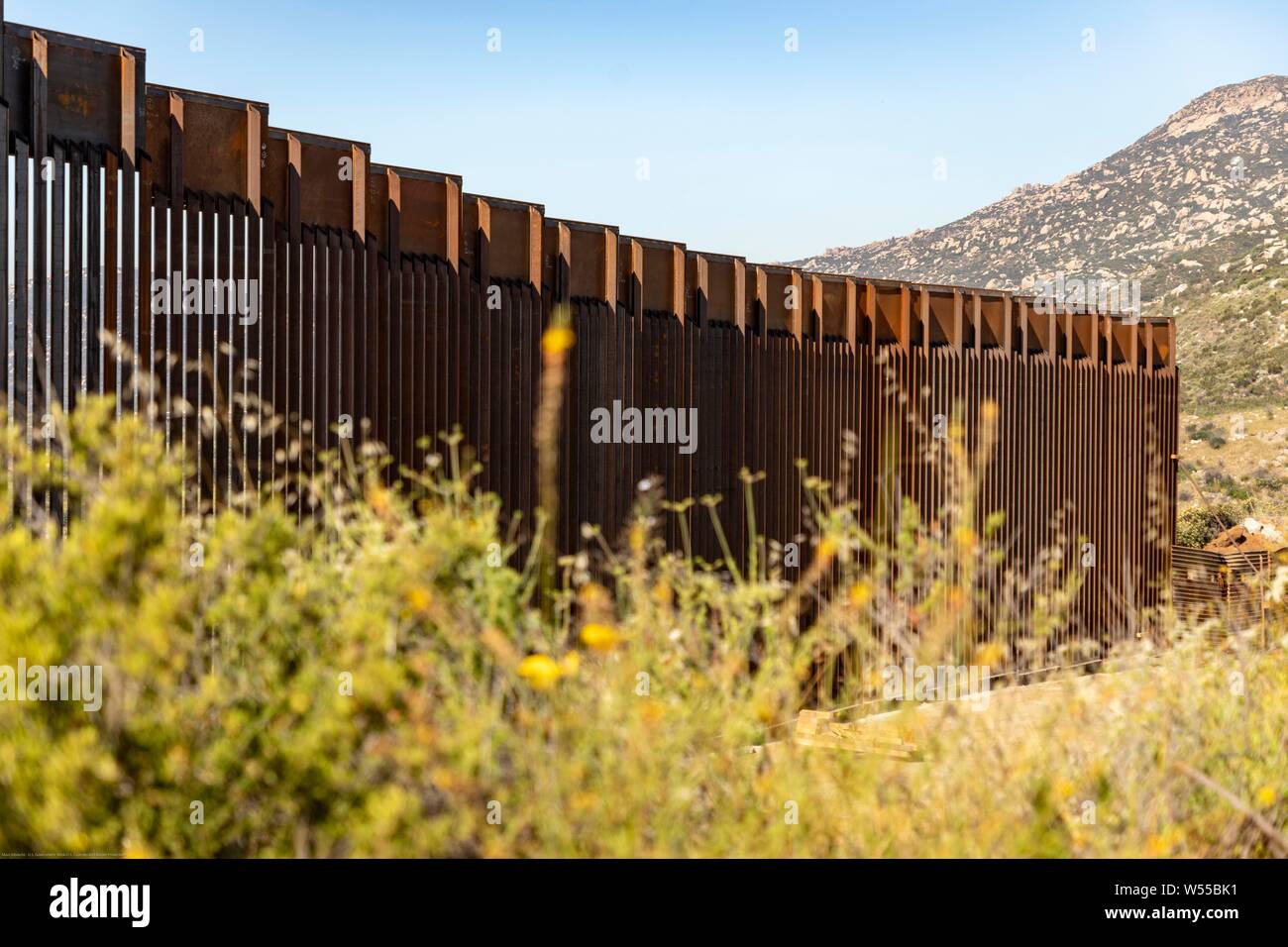 A section of replacement border wall along the southern border with Mexico June 19, 2019 near Tecate, California. The replacement was authorized under the Obama administration and is in the process of being completed. Stock Photo