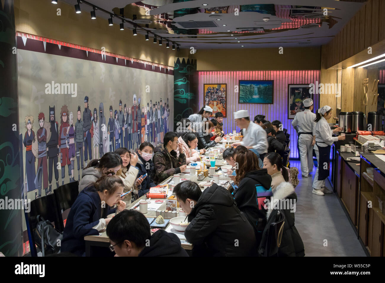 Chinese customers and manga fans dine in the world's first licensed ramen restaurant in the inspiration for Uzumaki Naruto's favorite place to get his Stock Photo