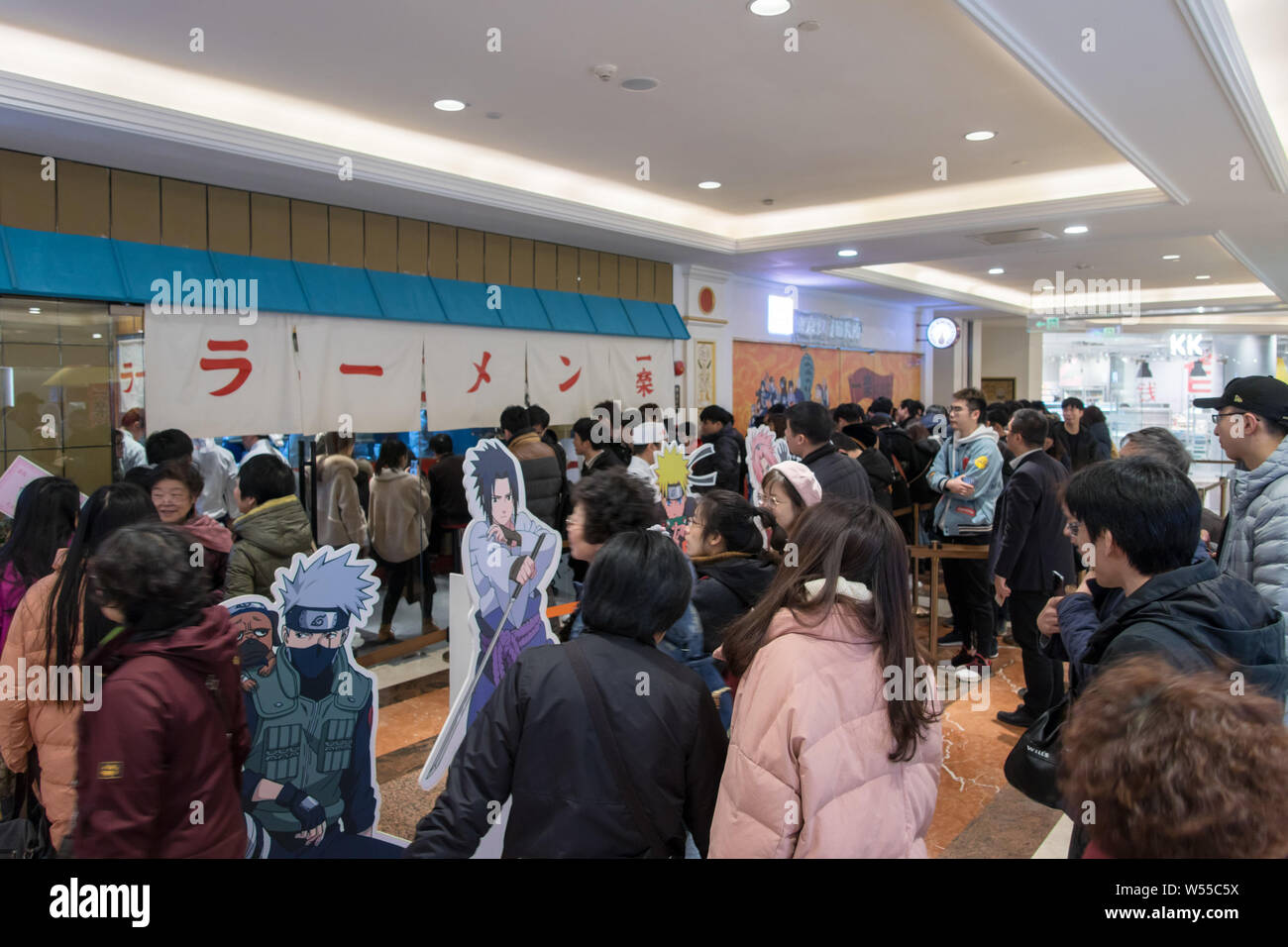 Chinese customers and manga fans queue up in the world's first licensed ramen restaurant in the inspiration for Uzumaki Naruto's favorite place to get Stock Photo