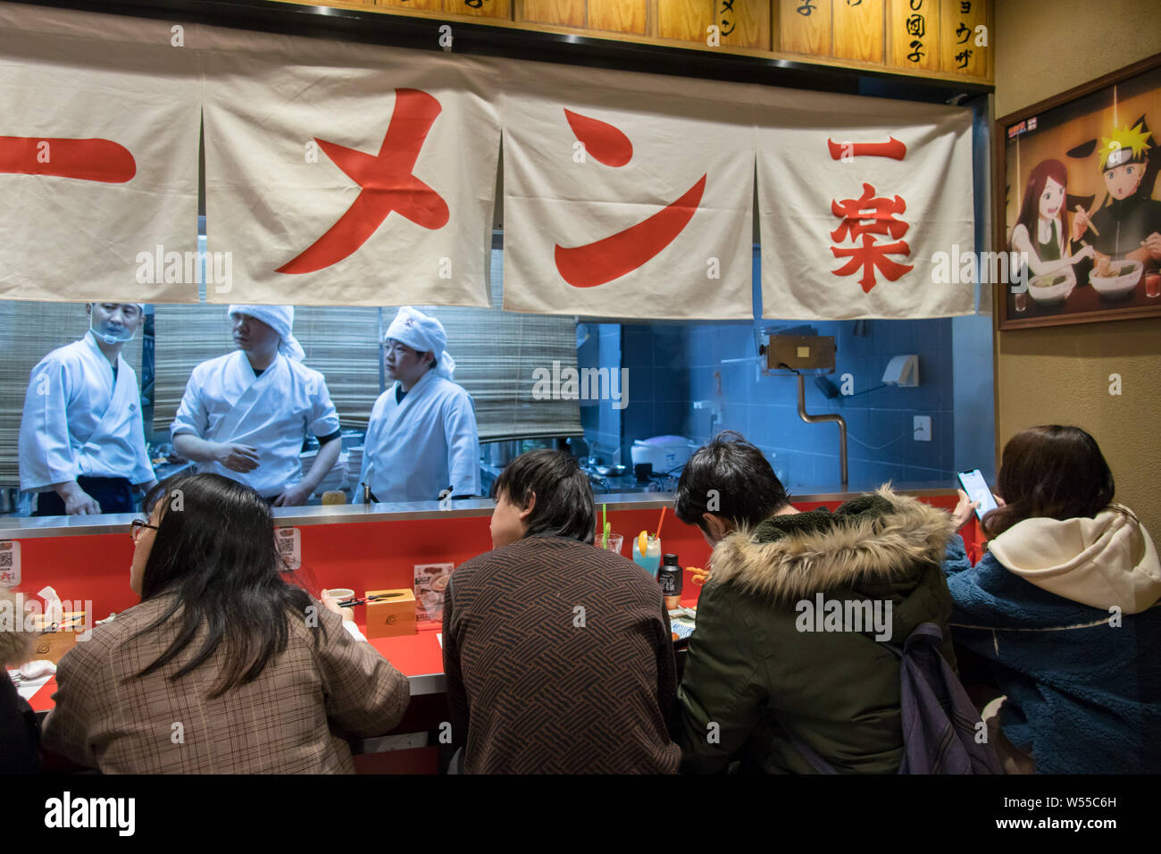 Chinese customers and manga fans dine in the world's first licensed ramen restaurant in the inspiration for Uzumaki Naruto's favorite place to get his Stock Photo