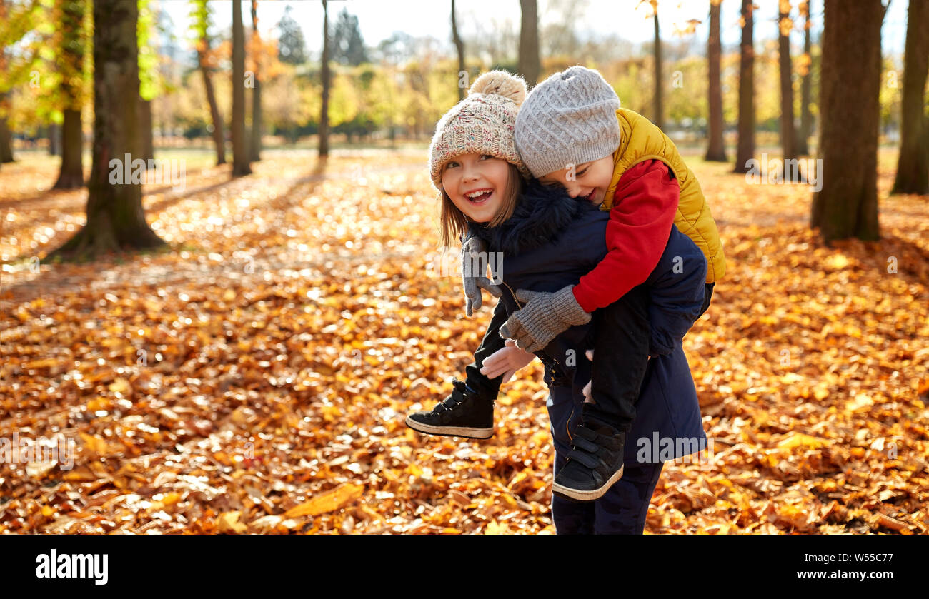 happy children having fun at autumn park Stock Photo - Alamy