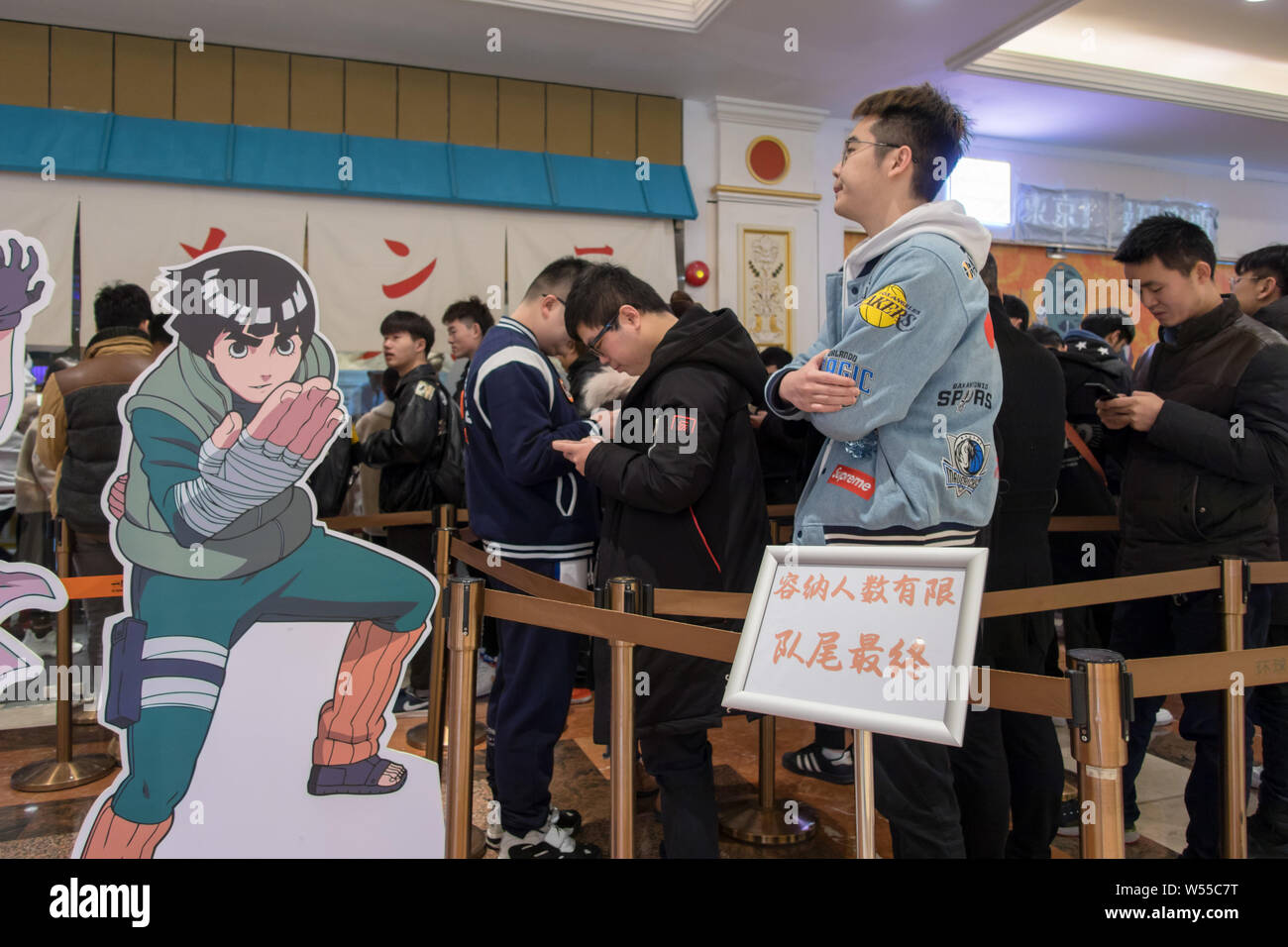 Chinese customers and manga fans queue up in the world's first licensed ramen restaurant in the inspiration for Uzumaki Naruto's favorite place to get Stock Photo